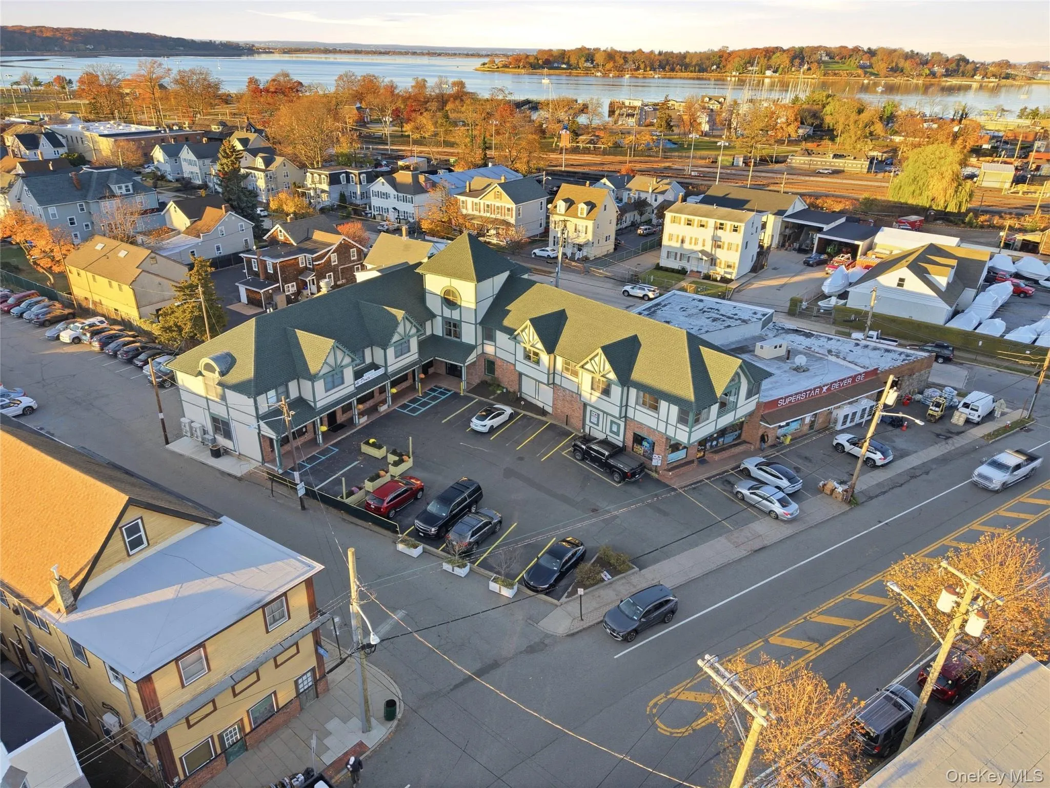 Aerial view of residential area with a large body of water Aerial view of residential area with a large body of water