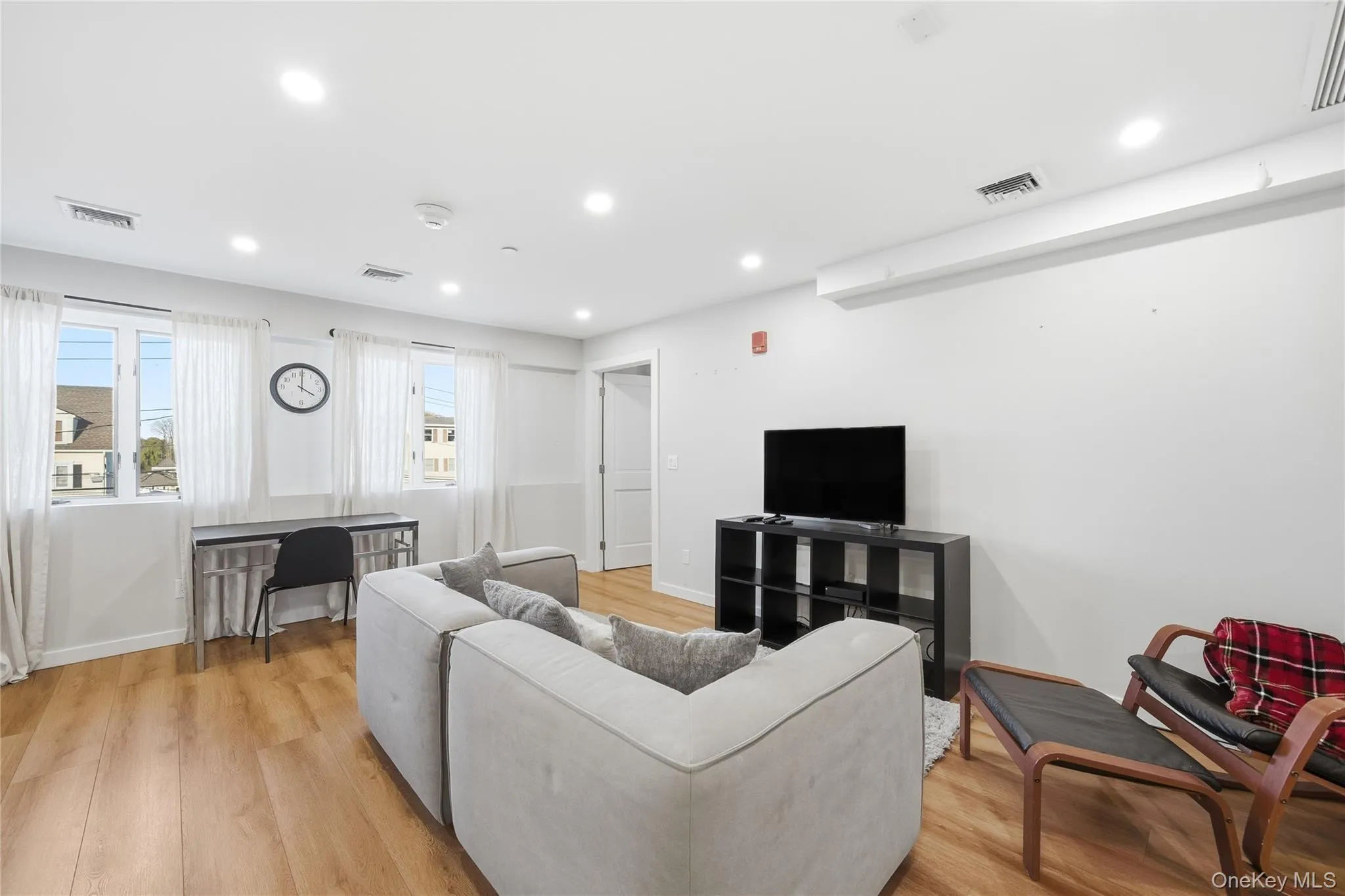 Living Room featuring recessed lighting and light wood-style floors Living Room featuring recessed lighting and light wood-style floors