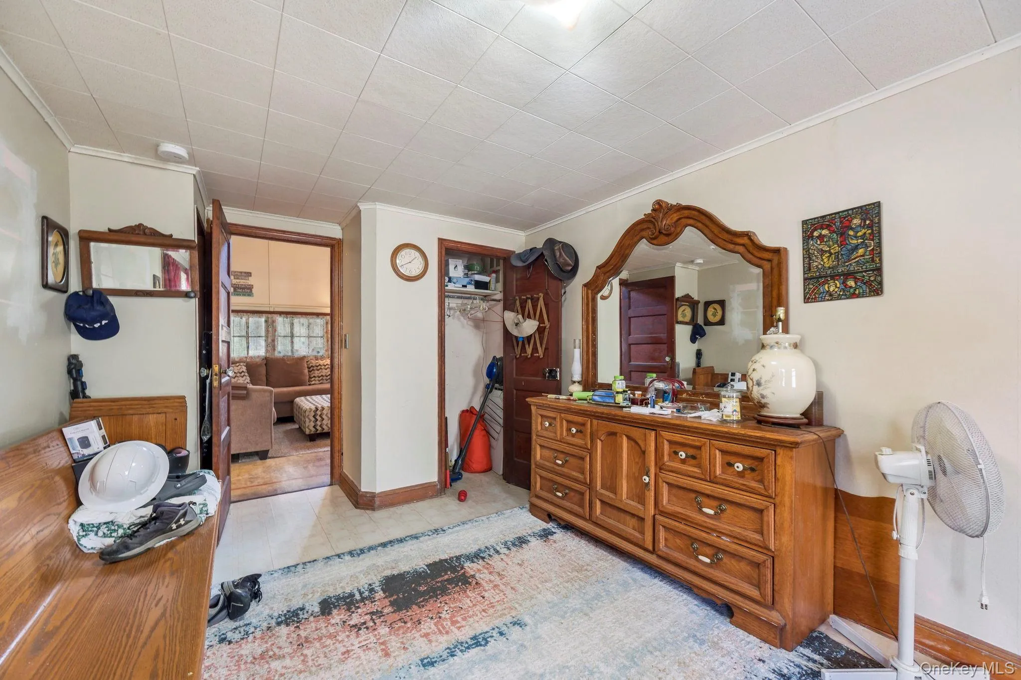 Bedroom featuring a closet and crown molding Bedroom featuring a closet and crown molding