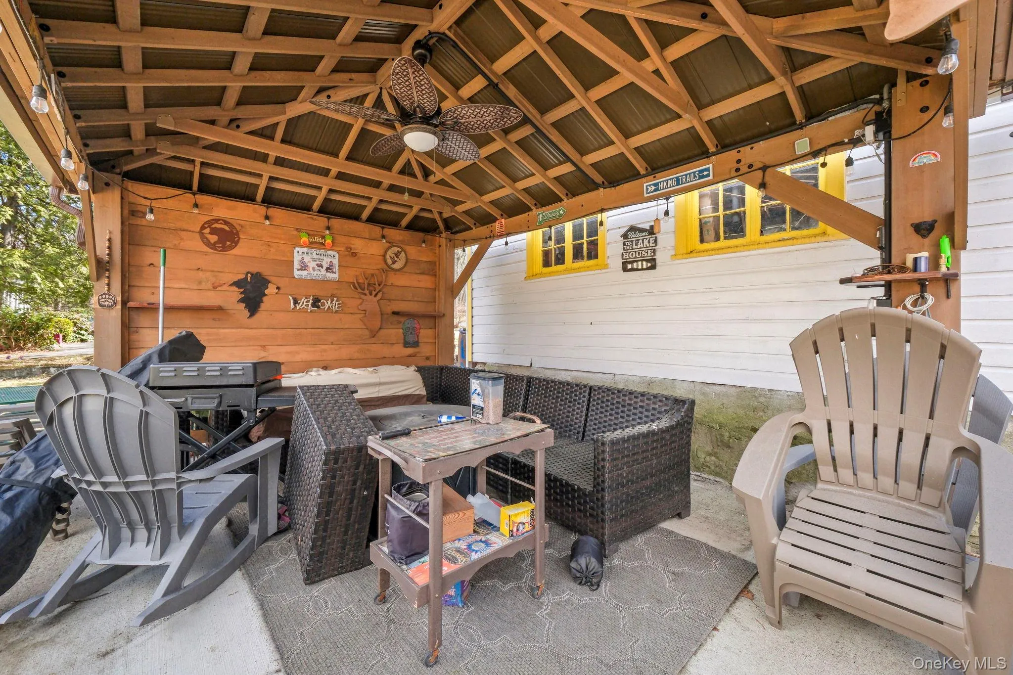 View of patio / terrace with a ceiling fan and an outdoor living space View of patio / terrace with a ceiling fan and an outdoor living space