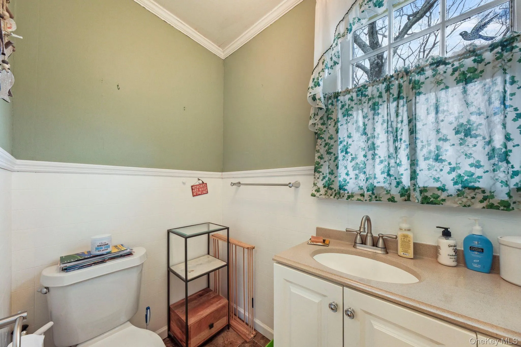 Bathroom featuring vanity and crown molding Bathroom featuring vanity and crown molding