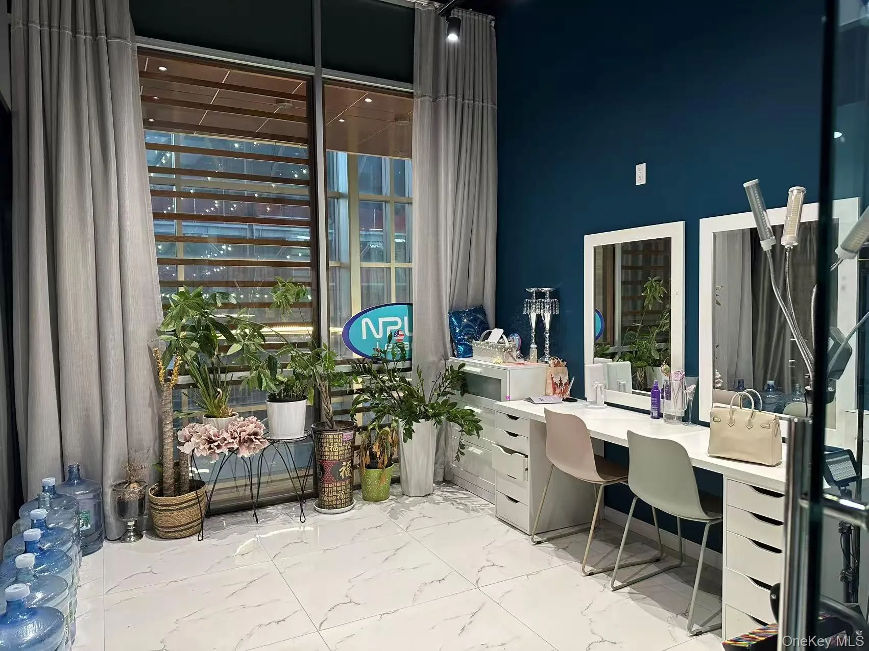 Office space featuring light marble finish floors Office space featuring light marble finish floors