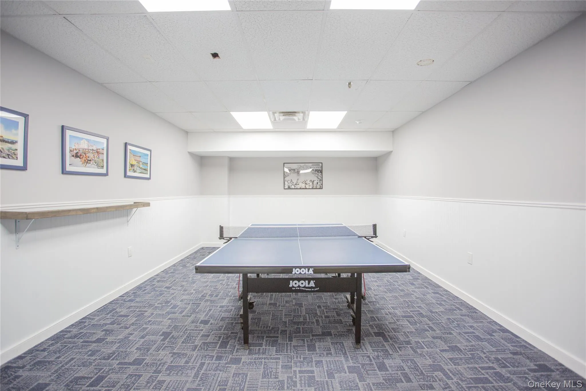 Playroom featuring a drop ceiling Playroom featuring a drop ceiling