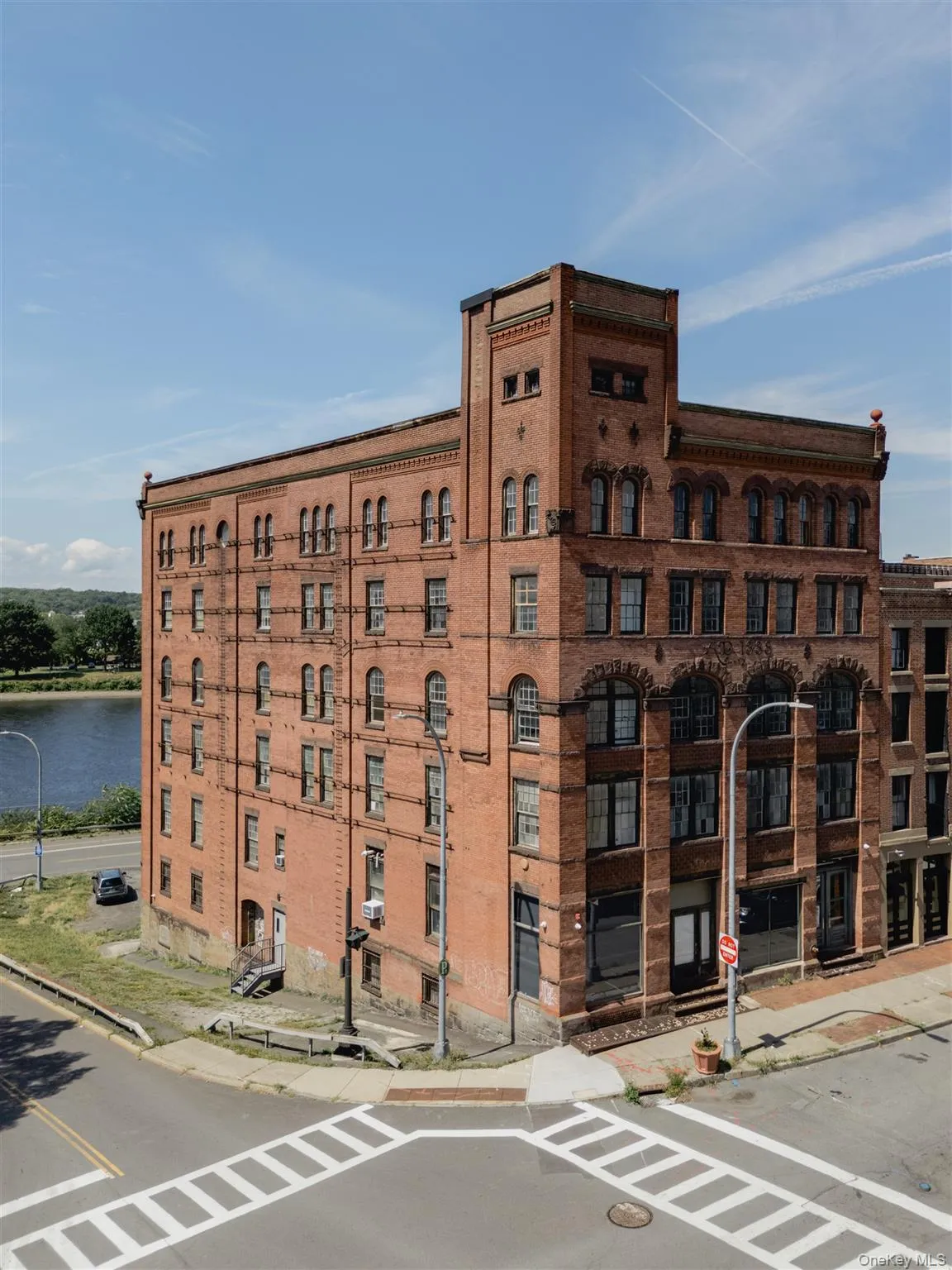 View of apartment building / complex featuring a water view View of apartment building / complex featuring a water view