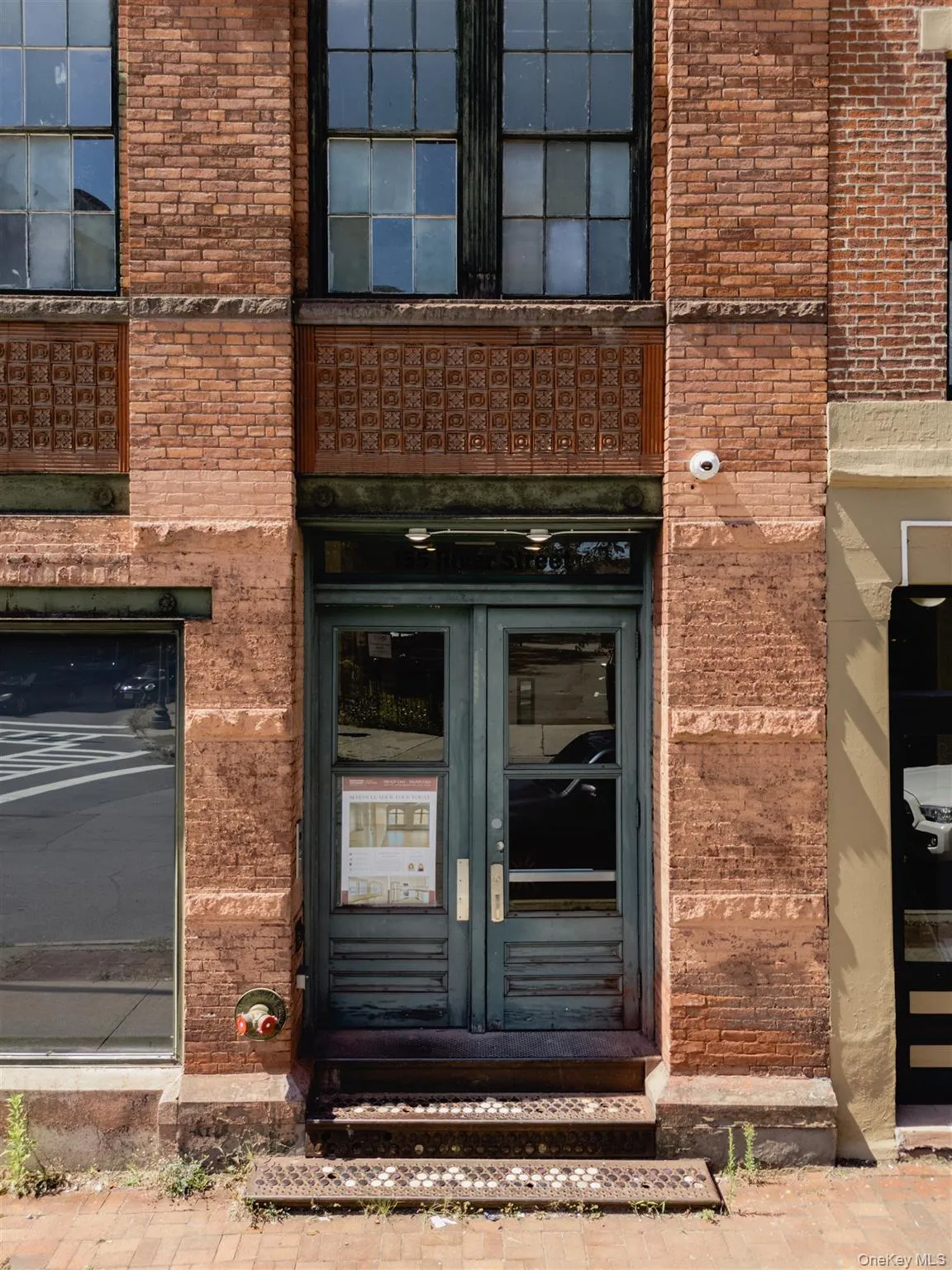 Doorway to property with brick siding and french doors Doorway to property with brick siding and french doors