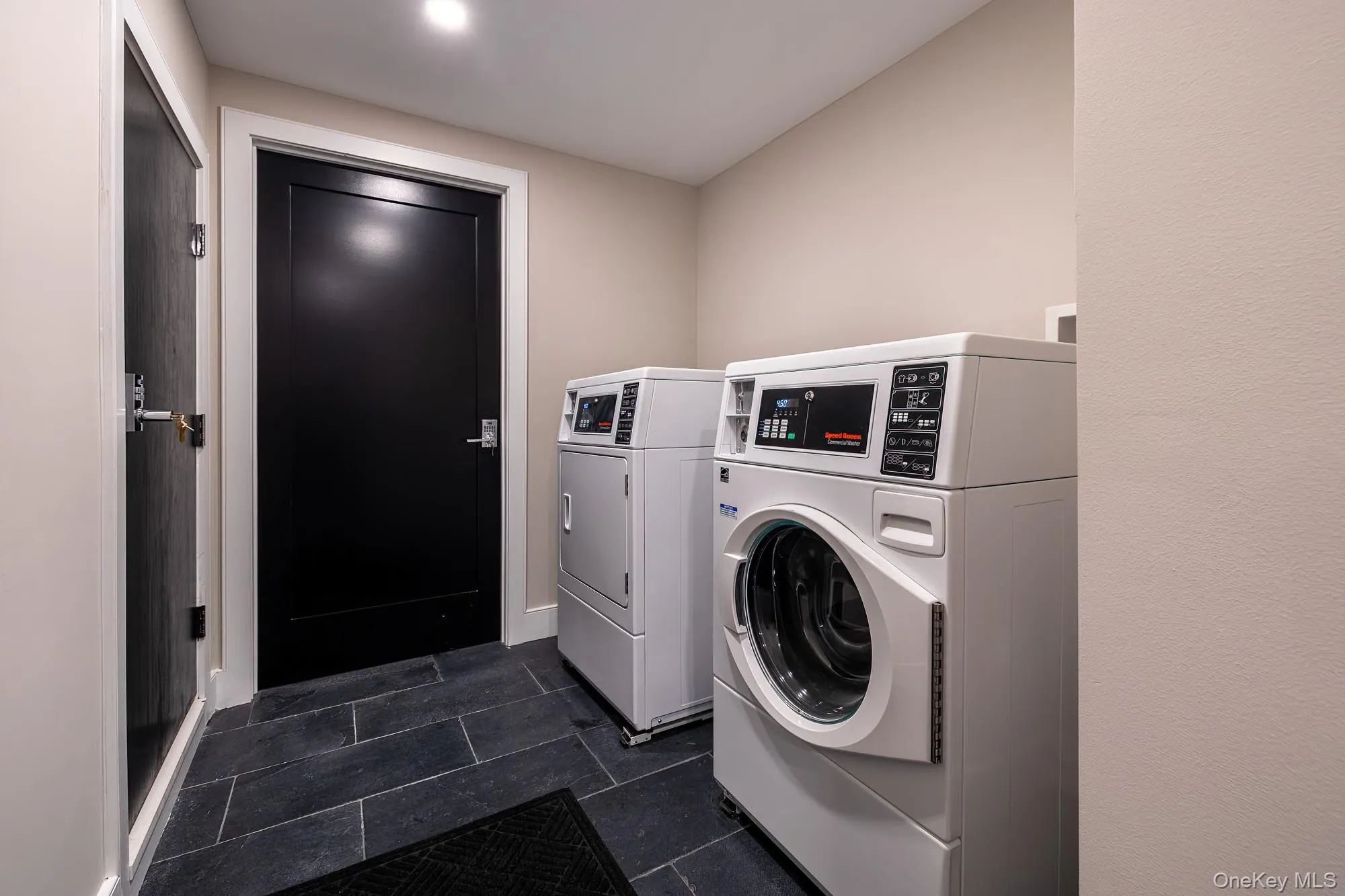 Shared laundry room featuring washer and dryer Shared laundry room featuring washer and dryer