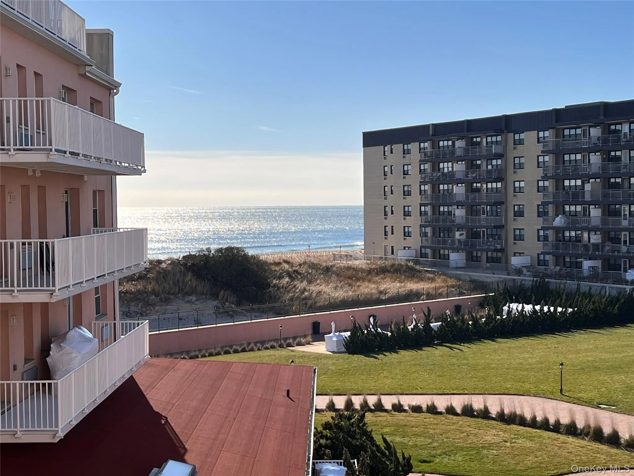View of community with a water view and a lawn View of community with a water view and a lawn