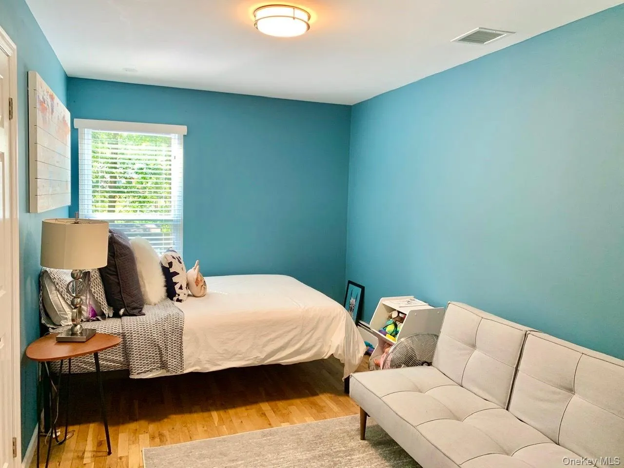 Bedroom with wood finished floors Bedroom with wood finished floors