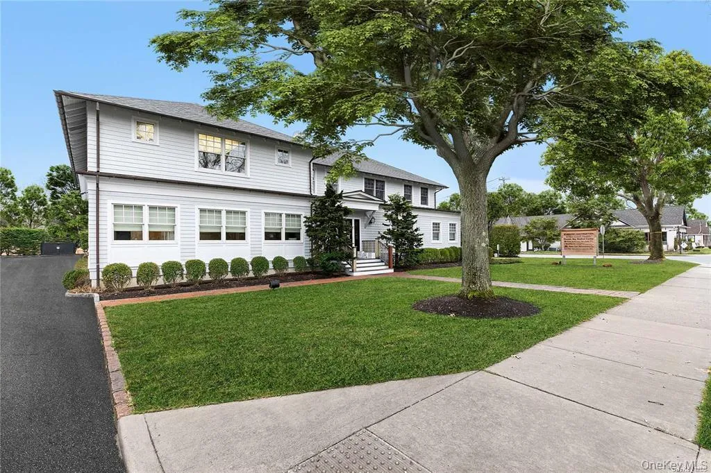 Traditional home with a front yard Traditional home with a front yard