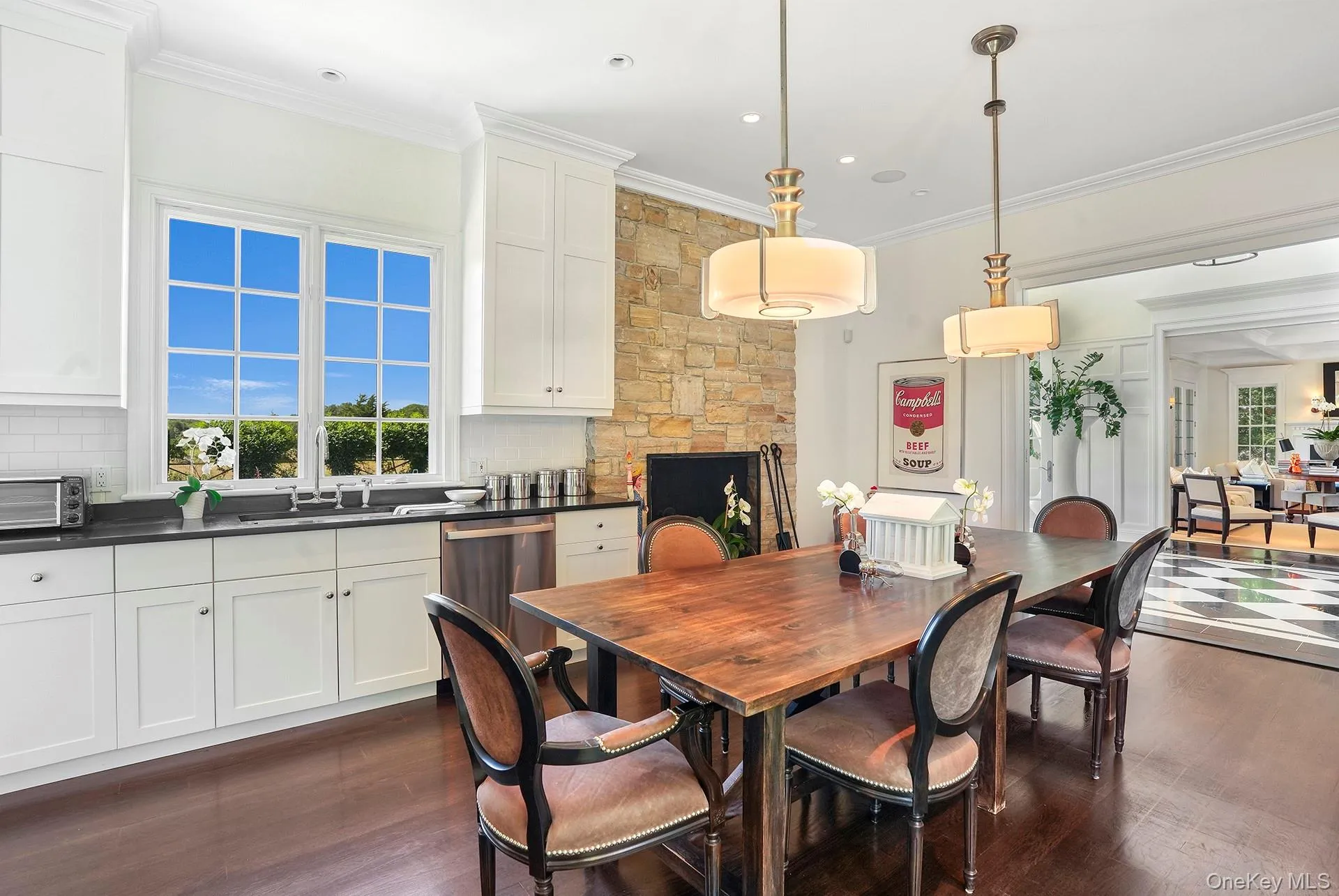 Dining room with ornamental molding, dark wood finished floors, and recessed lighting Dining room with ornamental molding, dark wood finished floors, and recessed lighting