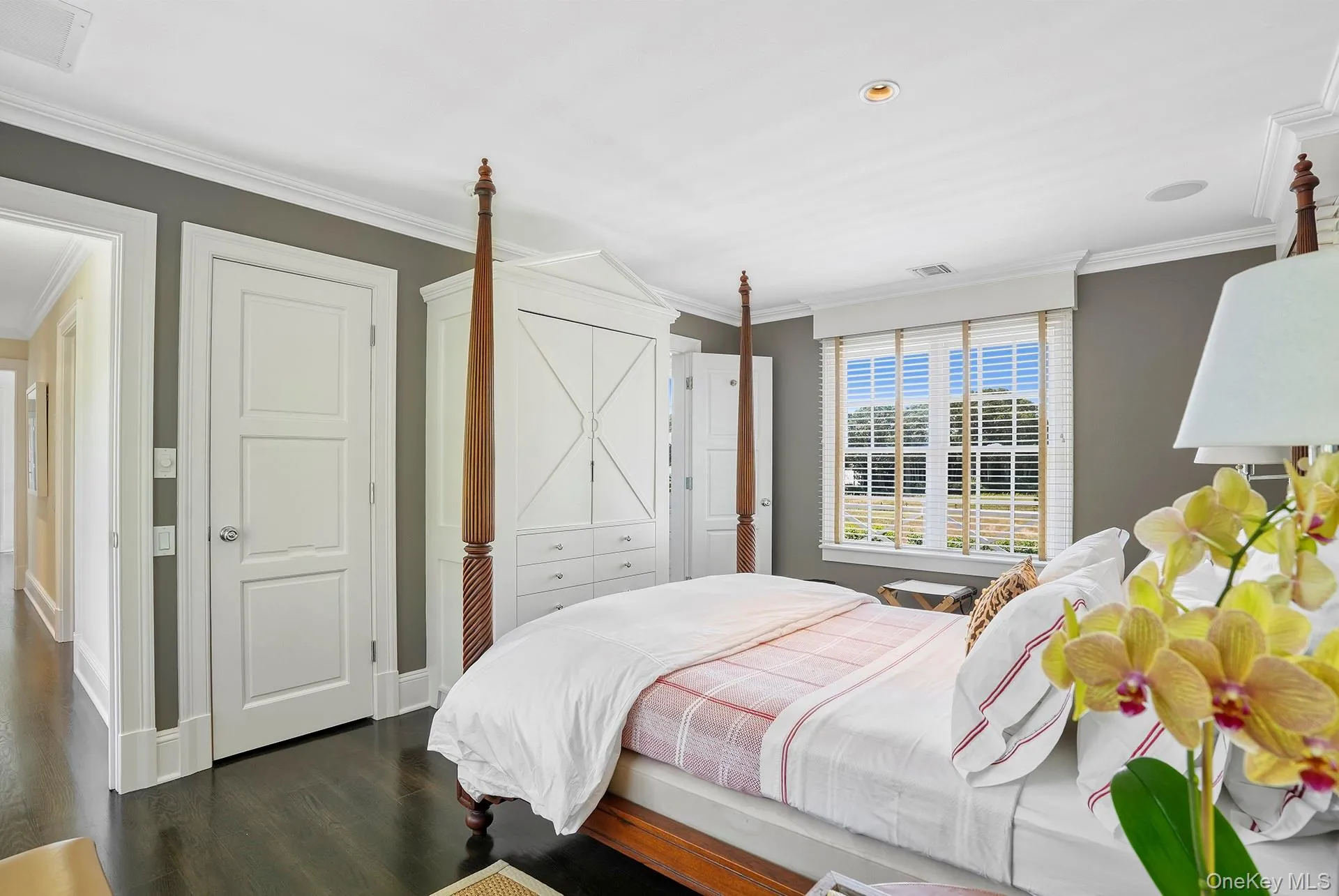 Bedroom featuring ornamental molding, dark wood-type flooring, and recessed lighting Bedroom featuring ornamental molding, dark wood-type flooring, and recessed lighting