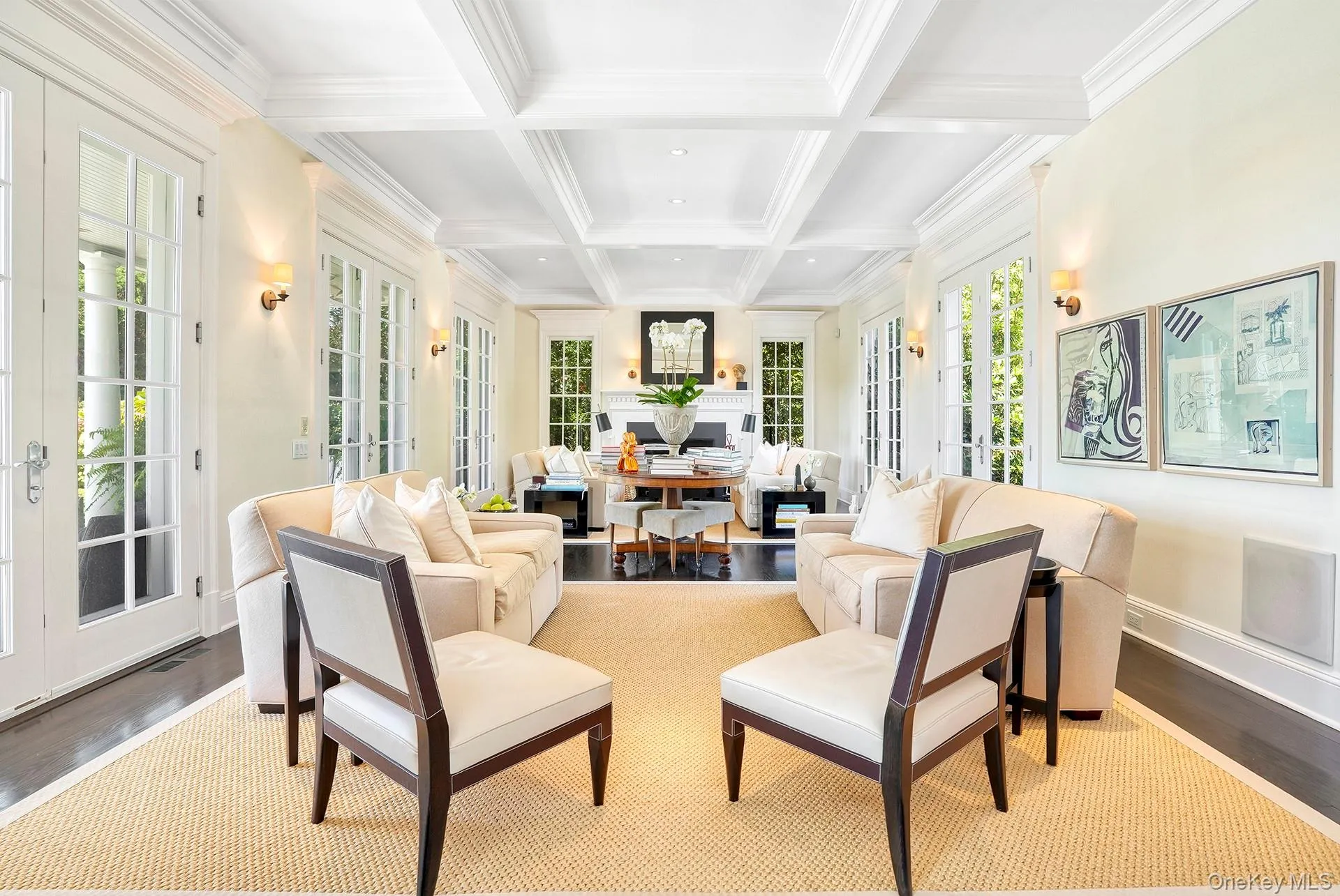 Sunroom featuring french doors, beam ceiling, and coffered ceiling Sunroom featuring french doors, beam ceiling, and coffered ceiling