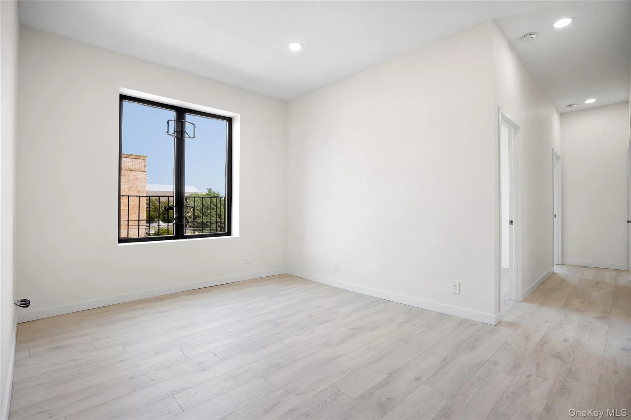 Spare room featuring light wood-style floors and recessed lighting Spare room featuring light wood-style floors and recessed lighting