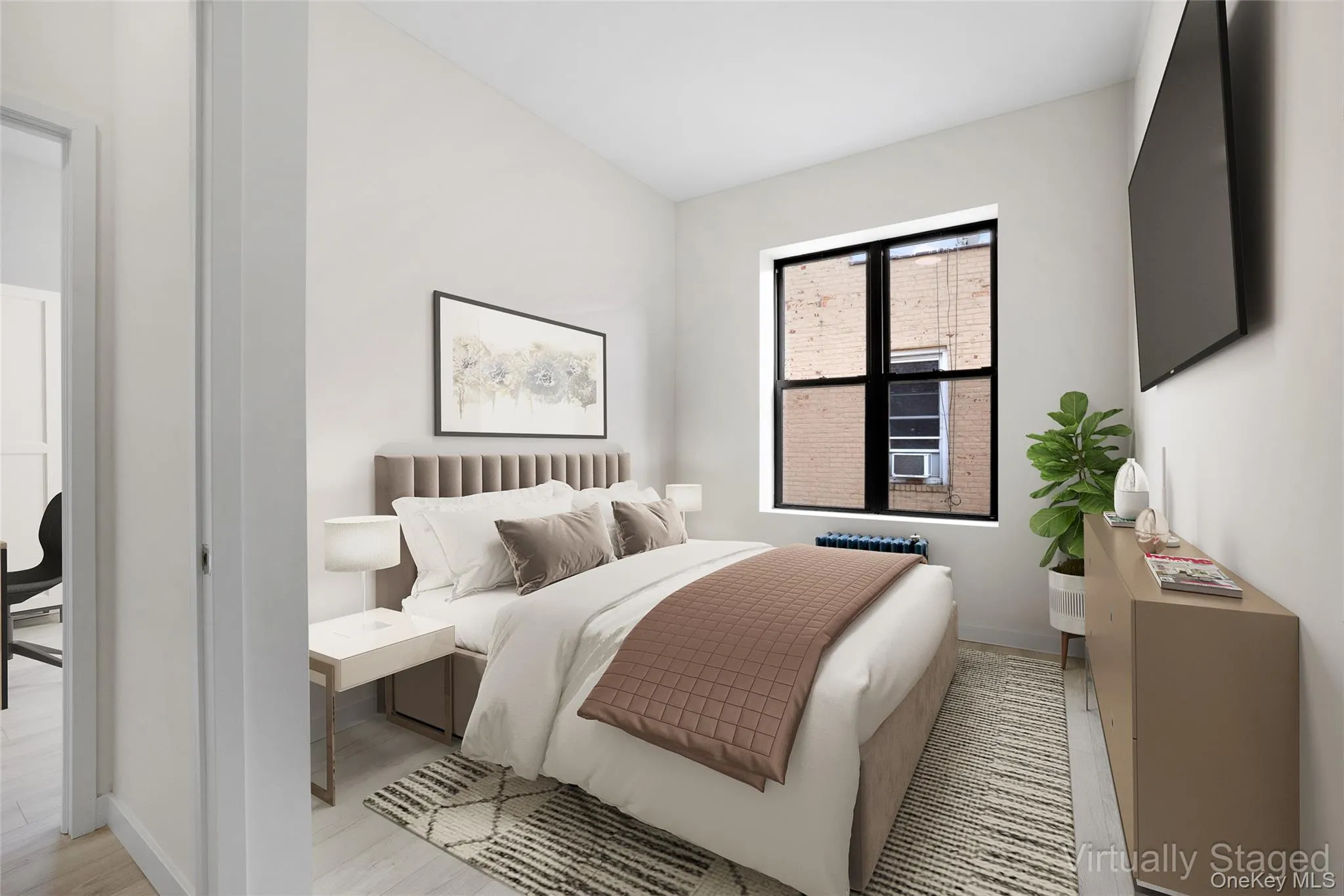 Bedroom with light wood-style floors and baseboards Bedroom with light wood-style floors and baseboards