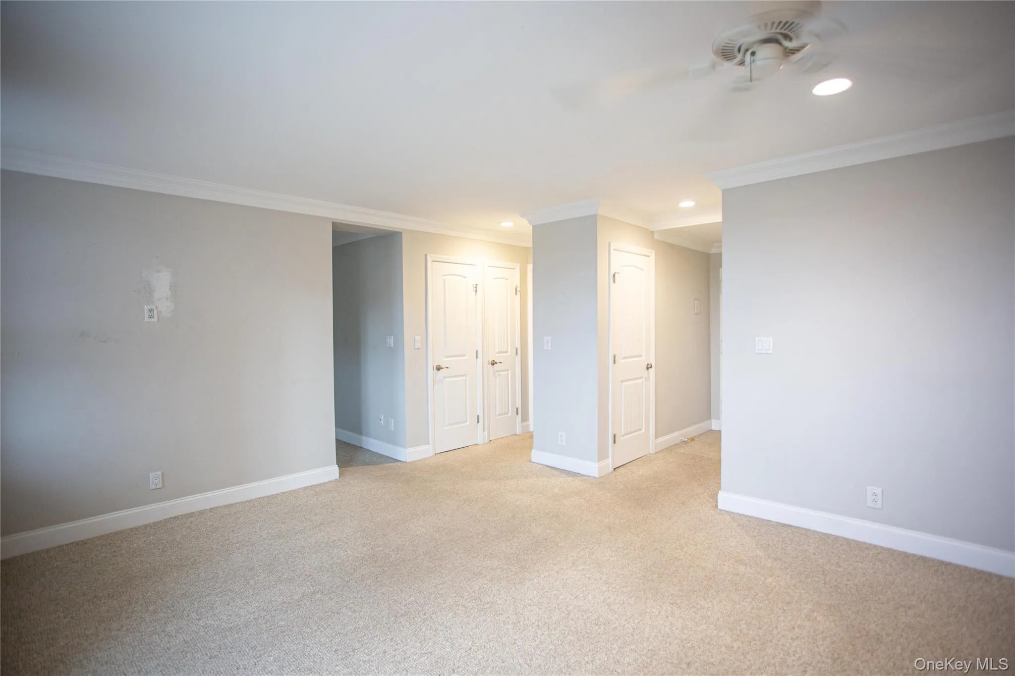 Spare room with crown molding, recessed lighting, light carpet, and ceiling fan Spare room with crown molding, recessed lighting, light carpet, and ceiling fan