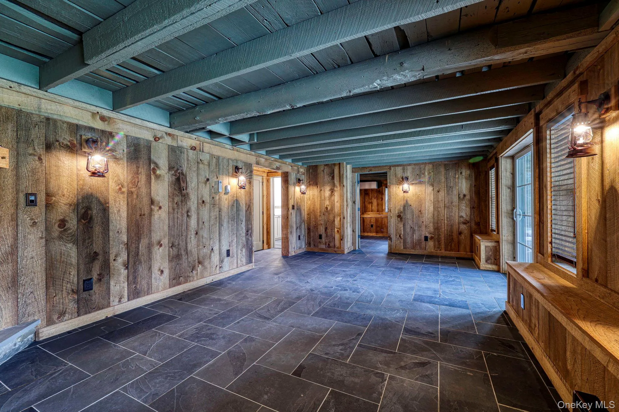 Below grade area with wood walls and baseboards Below grade area with wood walls and baseboards