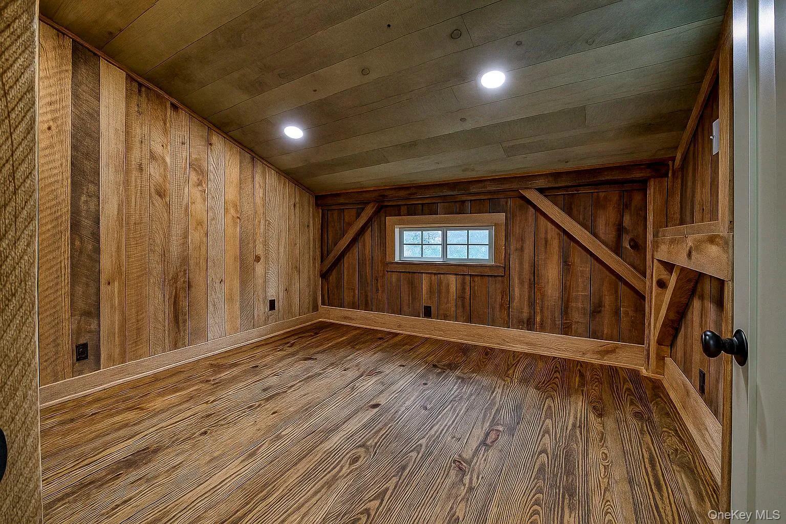Bonus room featuring wood finished floors, recessed lighting, wood walls, and wood ceiling Bonus room featuring wood finished floors, recessed lighting, wood walls, and wood ceiling