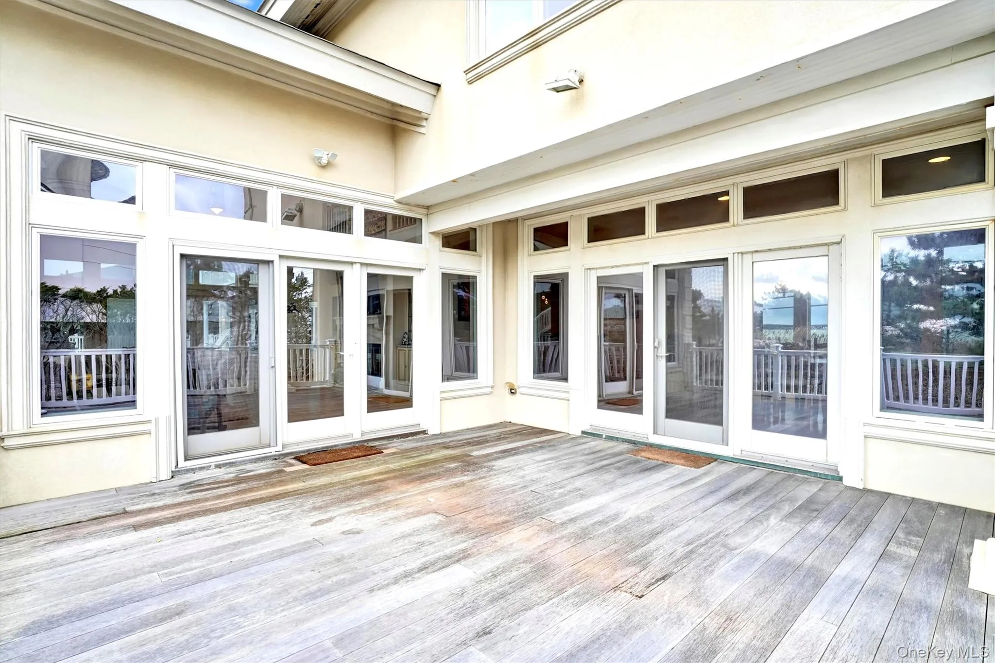 Double french doors from Dining  Room and Living Room to Deck for Entertaining.