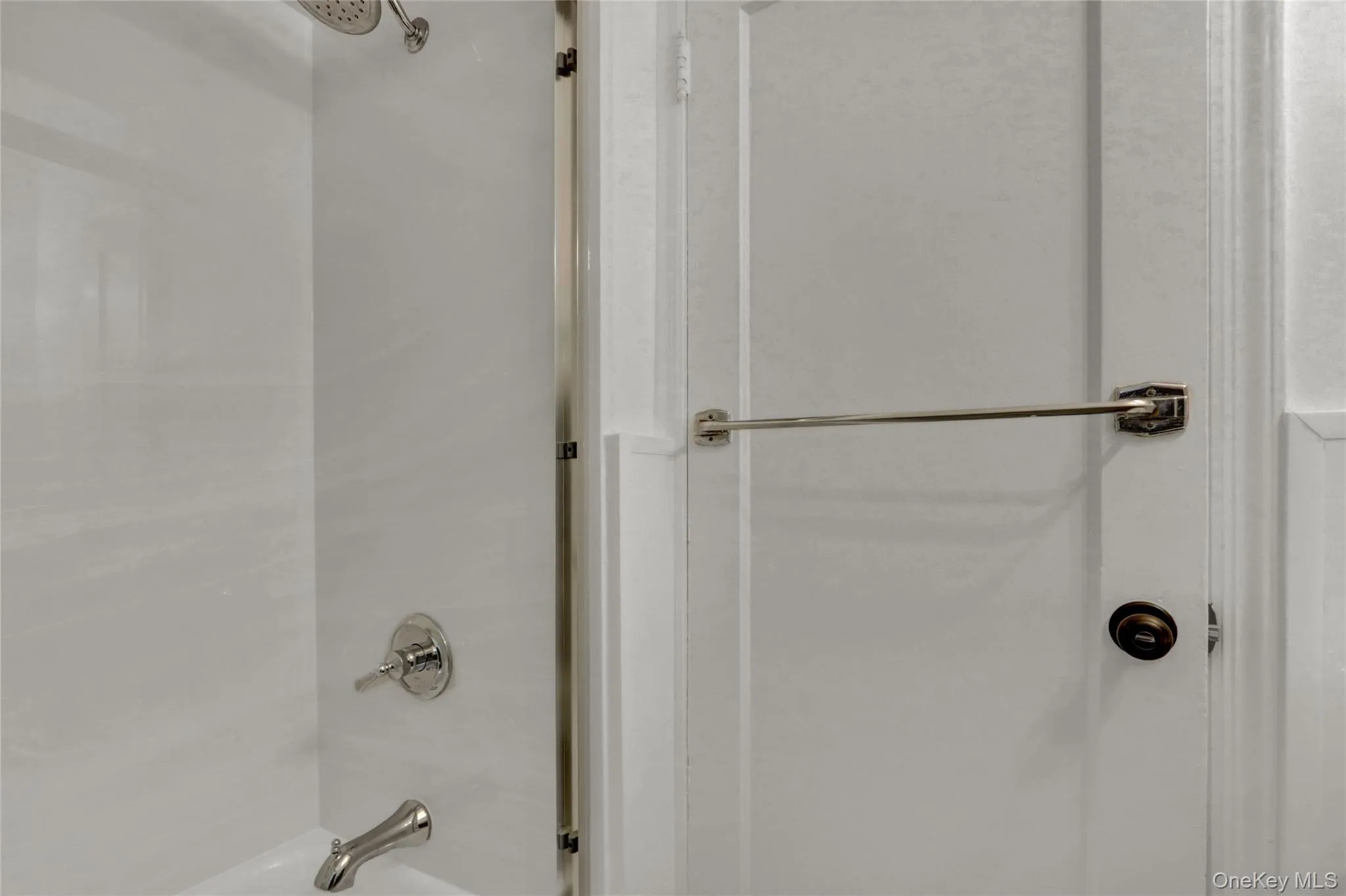 Bathroom featuring shower / bathtub combination Bathroom featuring shower / bathtub combination