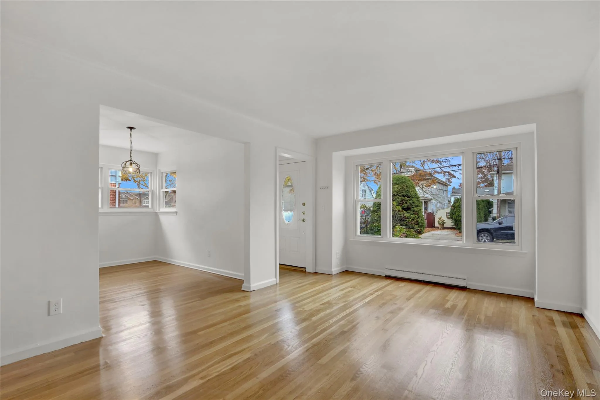 Unfurnished living room with light wood finished floors Unfurnished living room with light wood finished floors