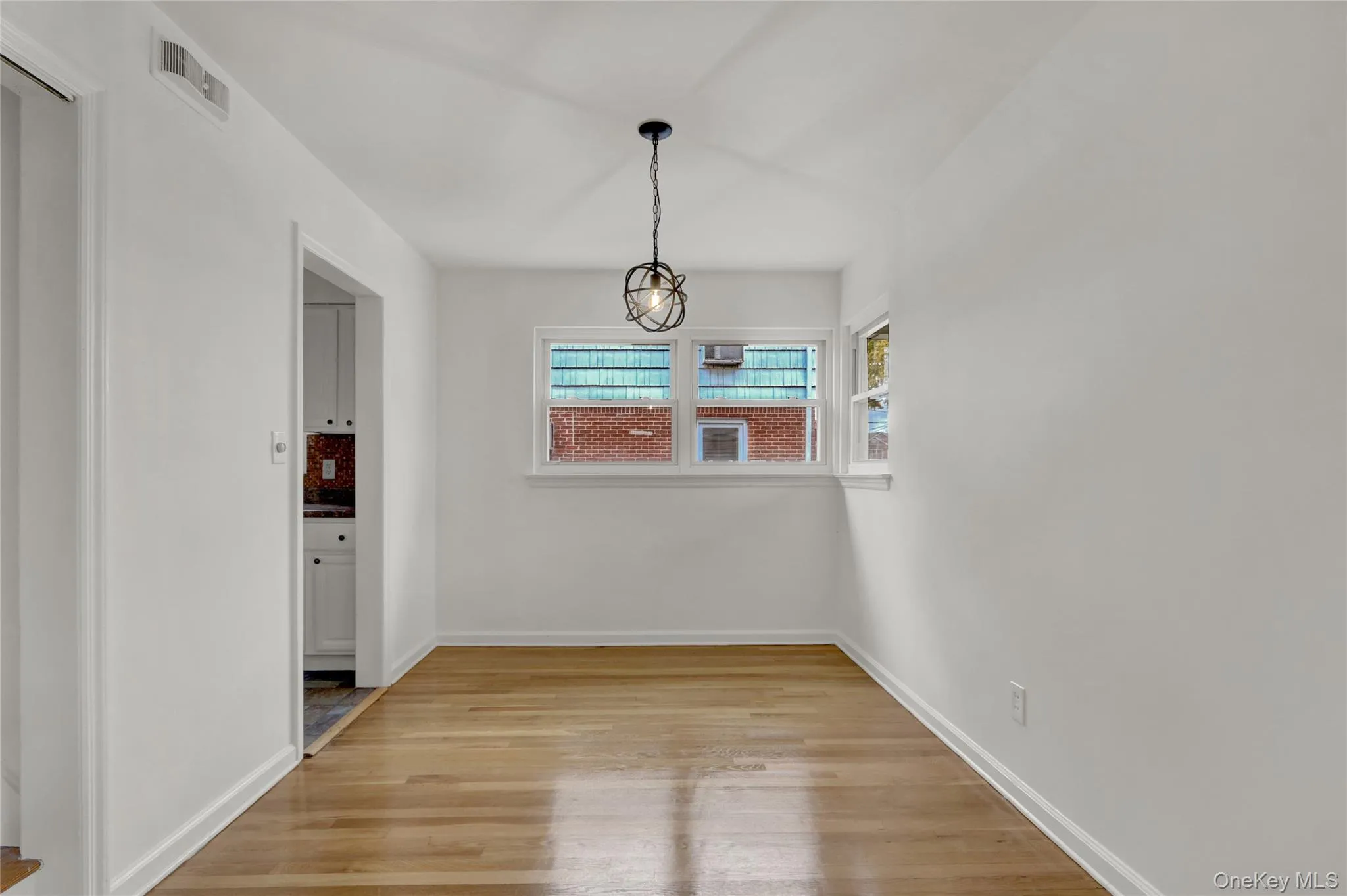 Unfurnished dining area with light wood finished floors Unfurnished dining area with light wood finished floors