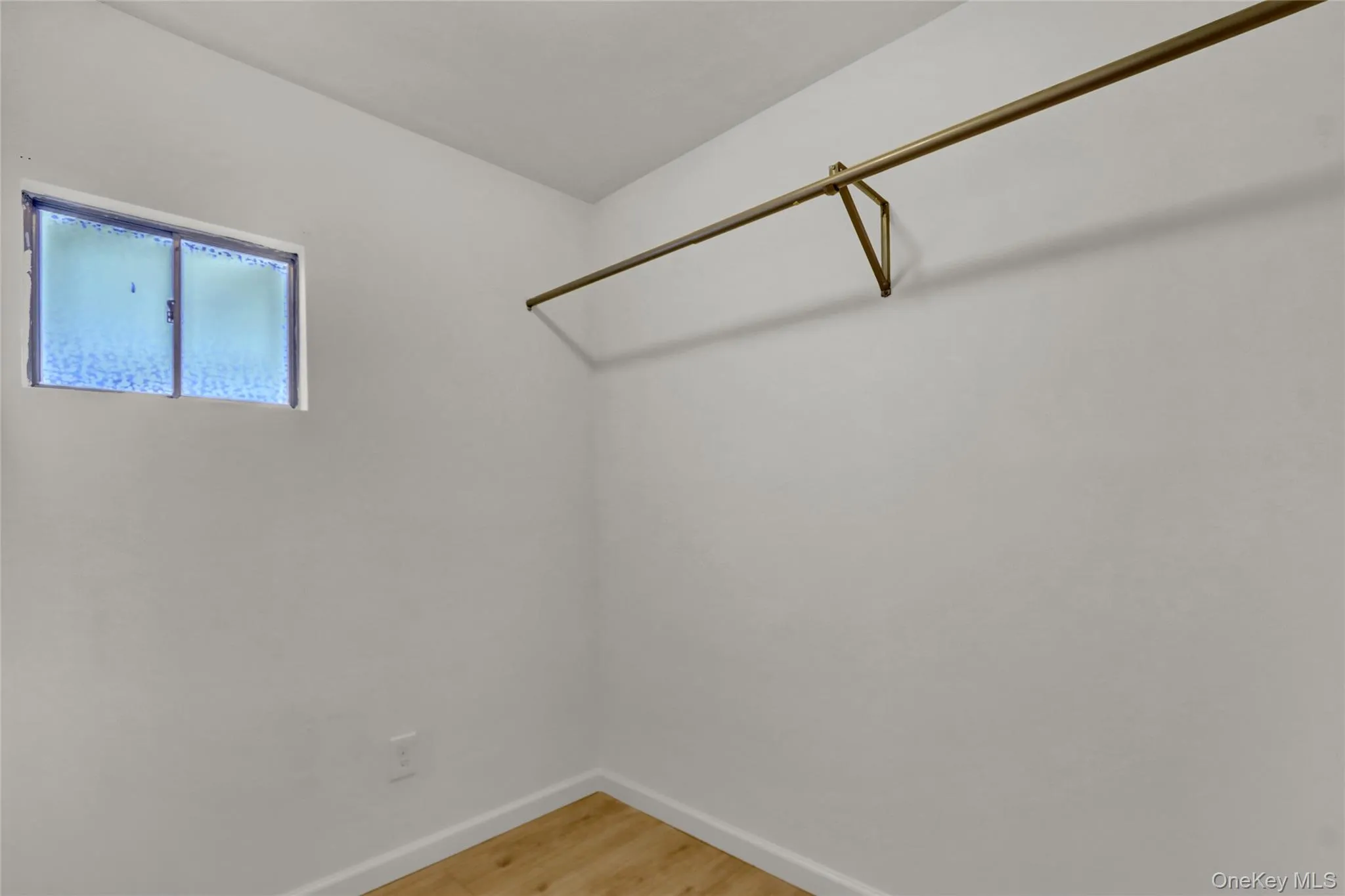 Walk in closet featuring light wood-style flooring on 2nd floor Walk in closet featuring light wood-style flooring on 2nd floor