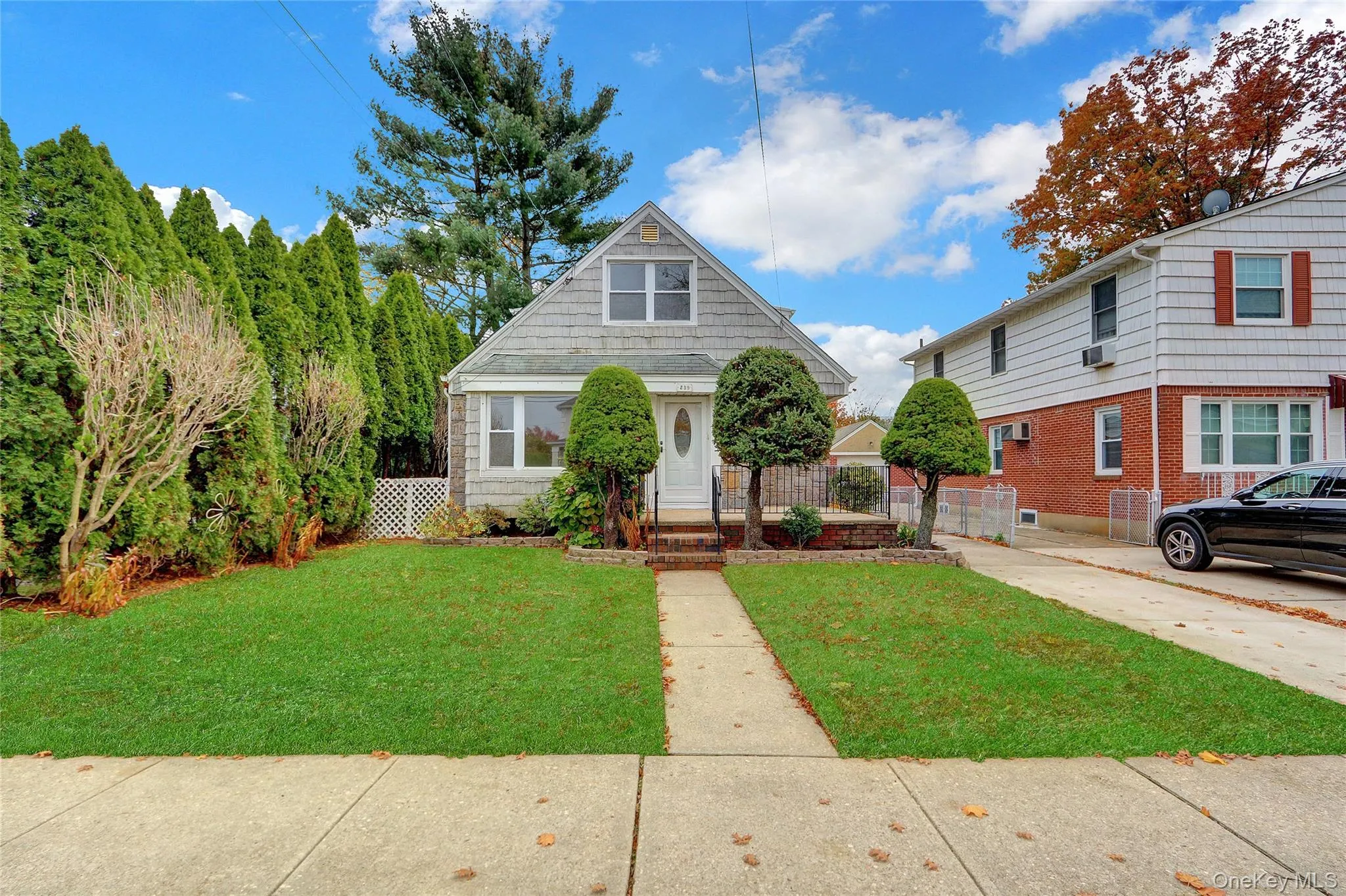 Cape-style home featuring brick / siding Cape-style home featuring brick / siding