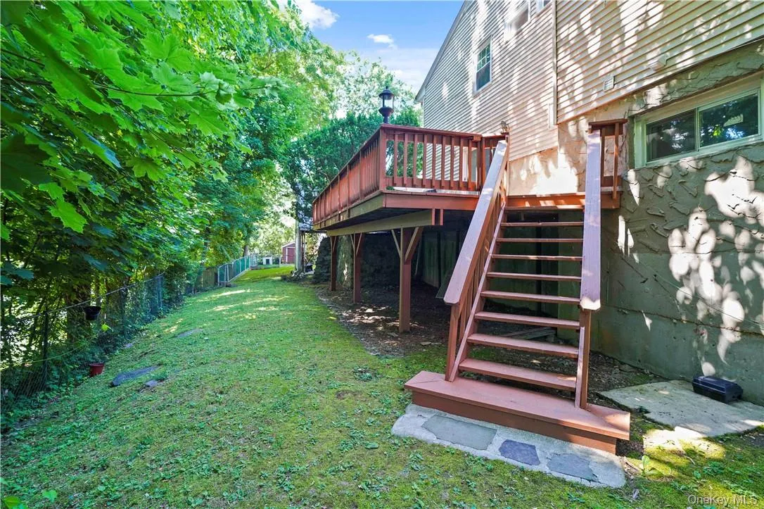 View of yard featuring a wooden deck View of yard featuring a wooden deck