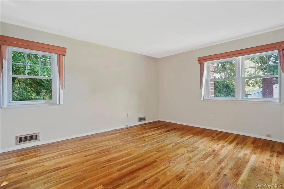 Unfurnished room with light hardwood / wood-style floors Unfurnished room with light hardwood / wood-style floors