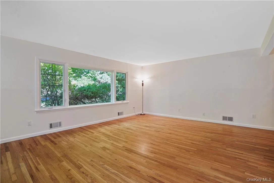 Empty room featuring light wood-type flooring Empty room featuring light wood-type flooring