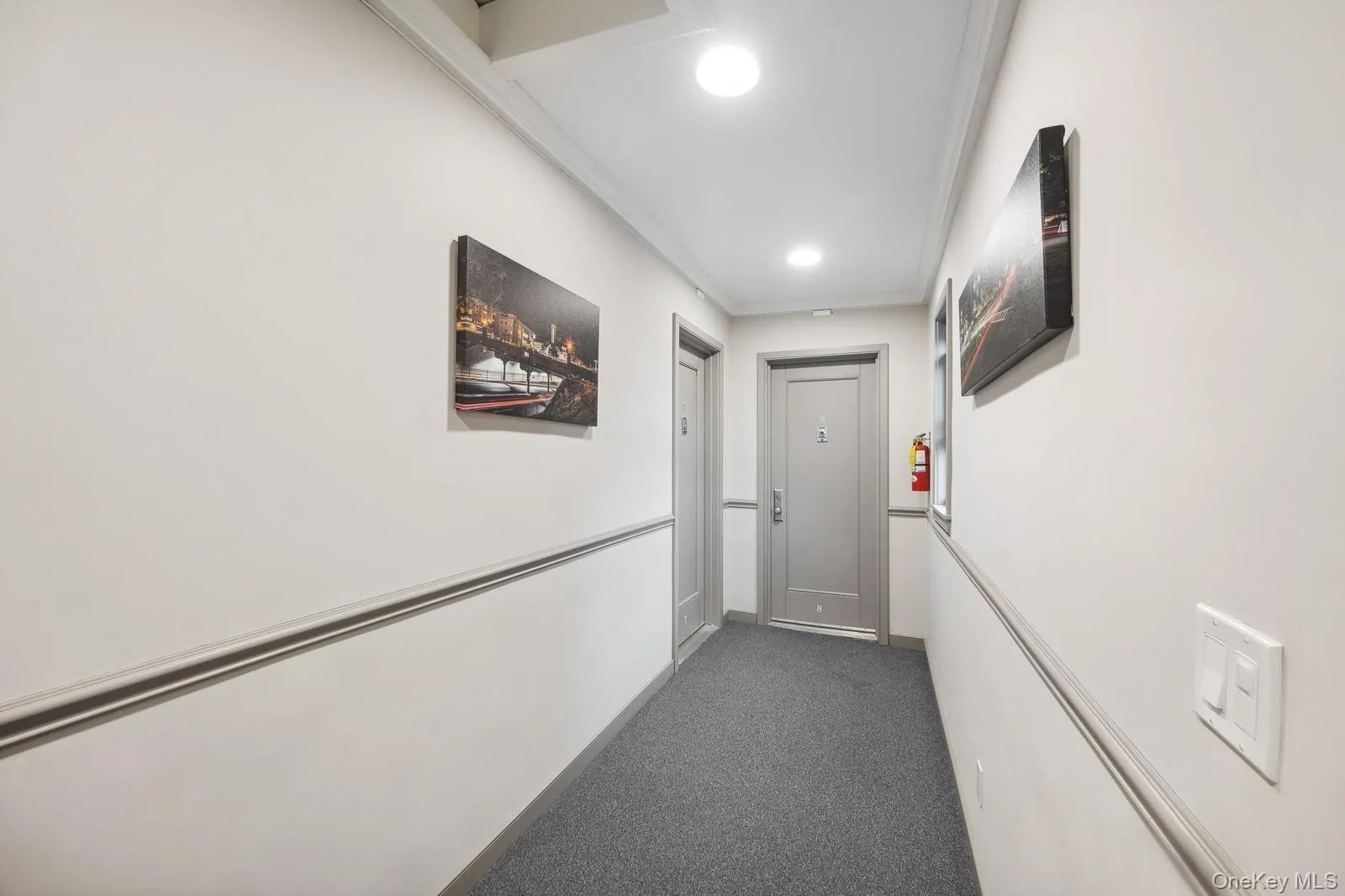 Hallway featuring carpet floors, recessed lighting, and ornamental molding Hallway featuring carpet floors, recessed lighting, and ornamental molding