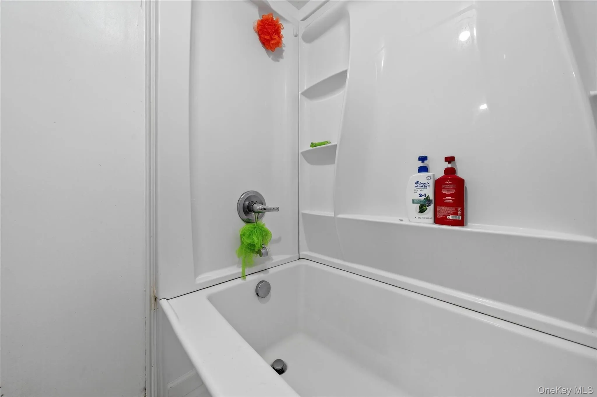 Bathroom featuring tub / shower combination Bathroom featuring tub / shower combination