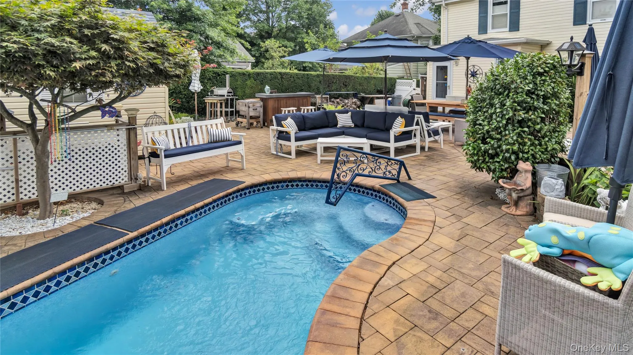 View of swimming pool featuring an outdoor living space, a patio, and a hot tub View of swimming pool featuring an outdoor living space, a patio, and a hot tub