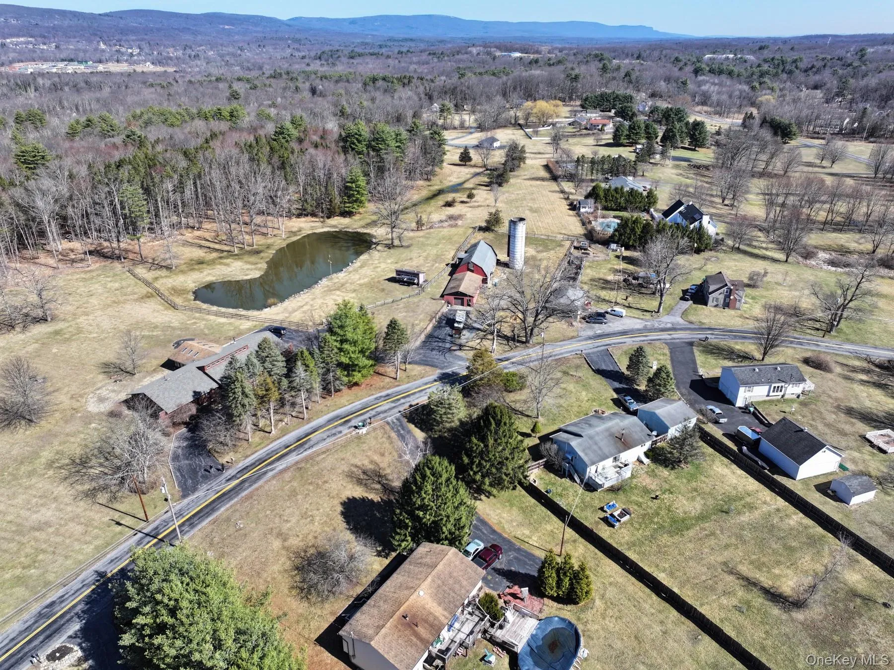 Birds eye view of property with a water and mountain view Birds eye view of property with a water and mountain view