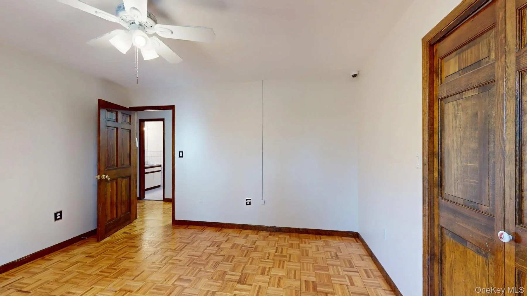 Spare room featuring baseboards and ceiling fan Spare room featuring baseboards and ceiling fan