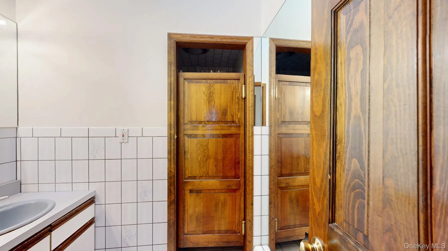 Bathroom with tile walls and vanity Bathroom with tile walls and vanity