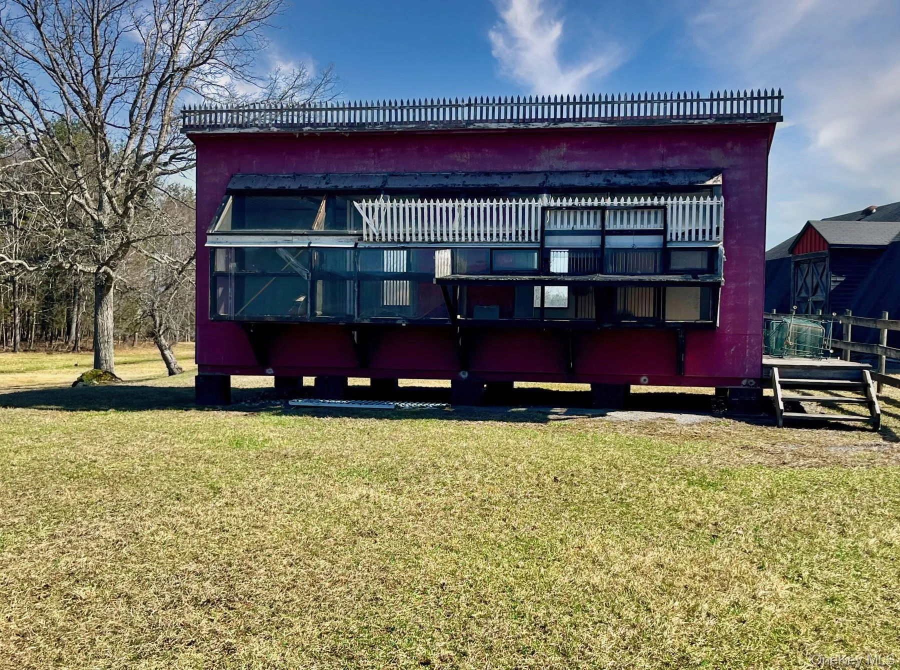 Rear view of property featuring a yard Rear view of property featuring a yard