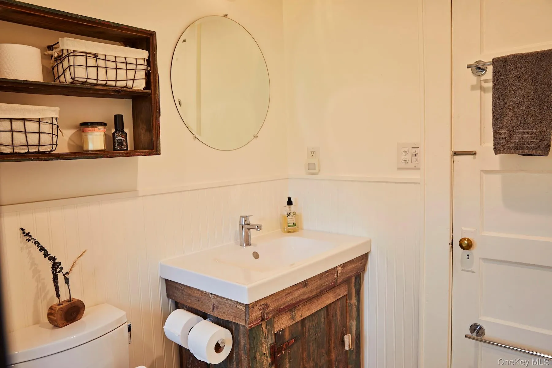 Bathroom with vanity and wainscoting Bathroom with vanity and wainscoting