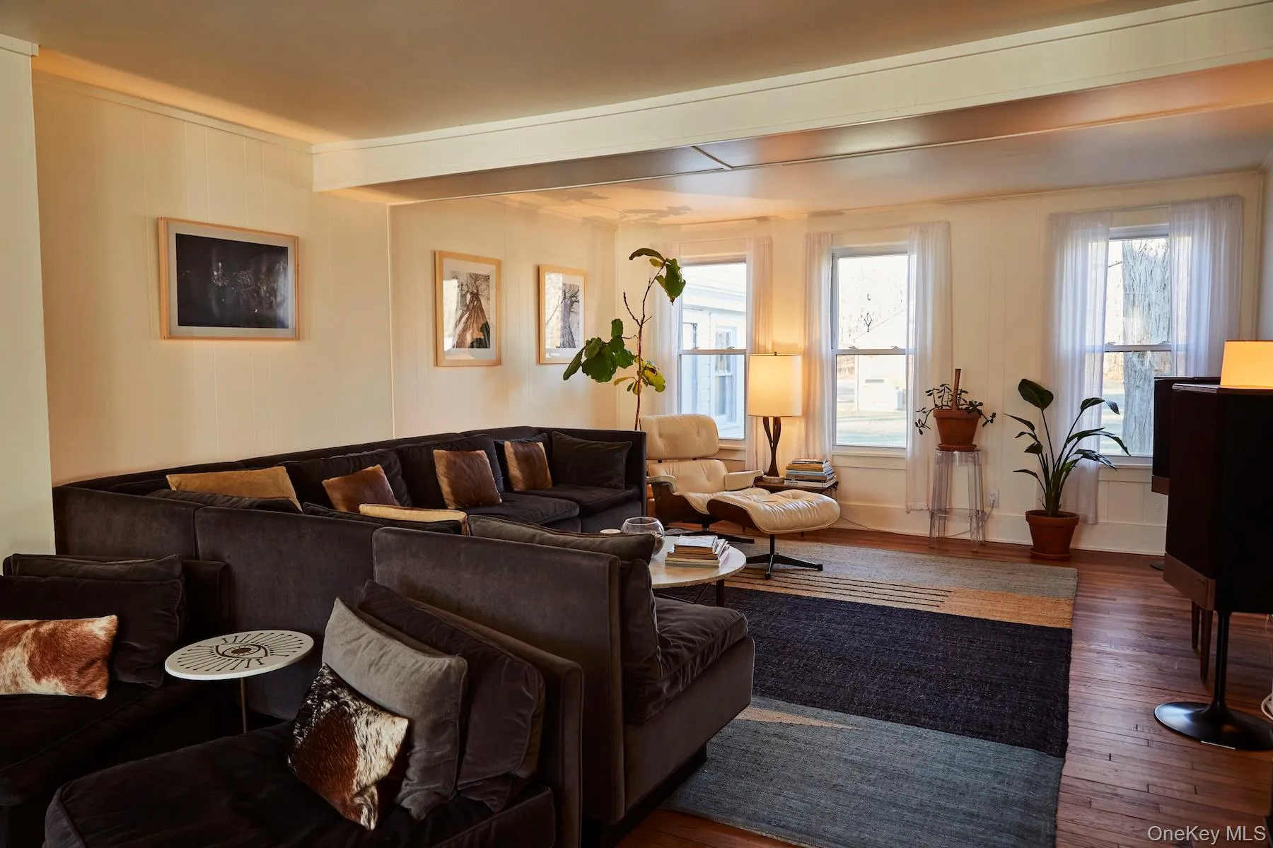 Living room featuring hardwood / wood-style floors Living room featuring hardwood / wood-style floors