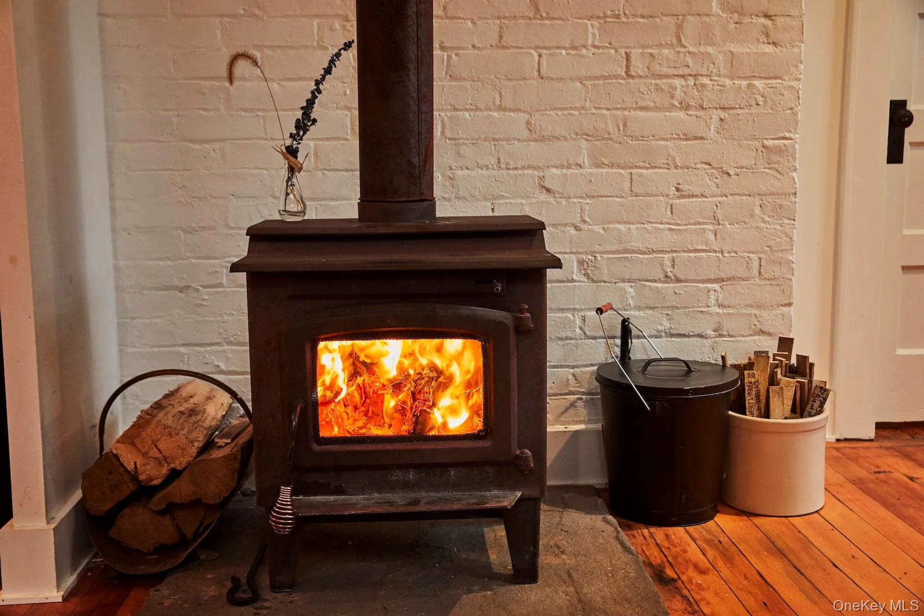 Detailed view of wood finished floors and a wood stove Detailed view of wood finished floors and a wood stove