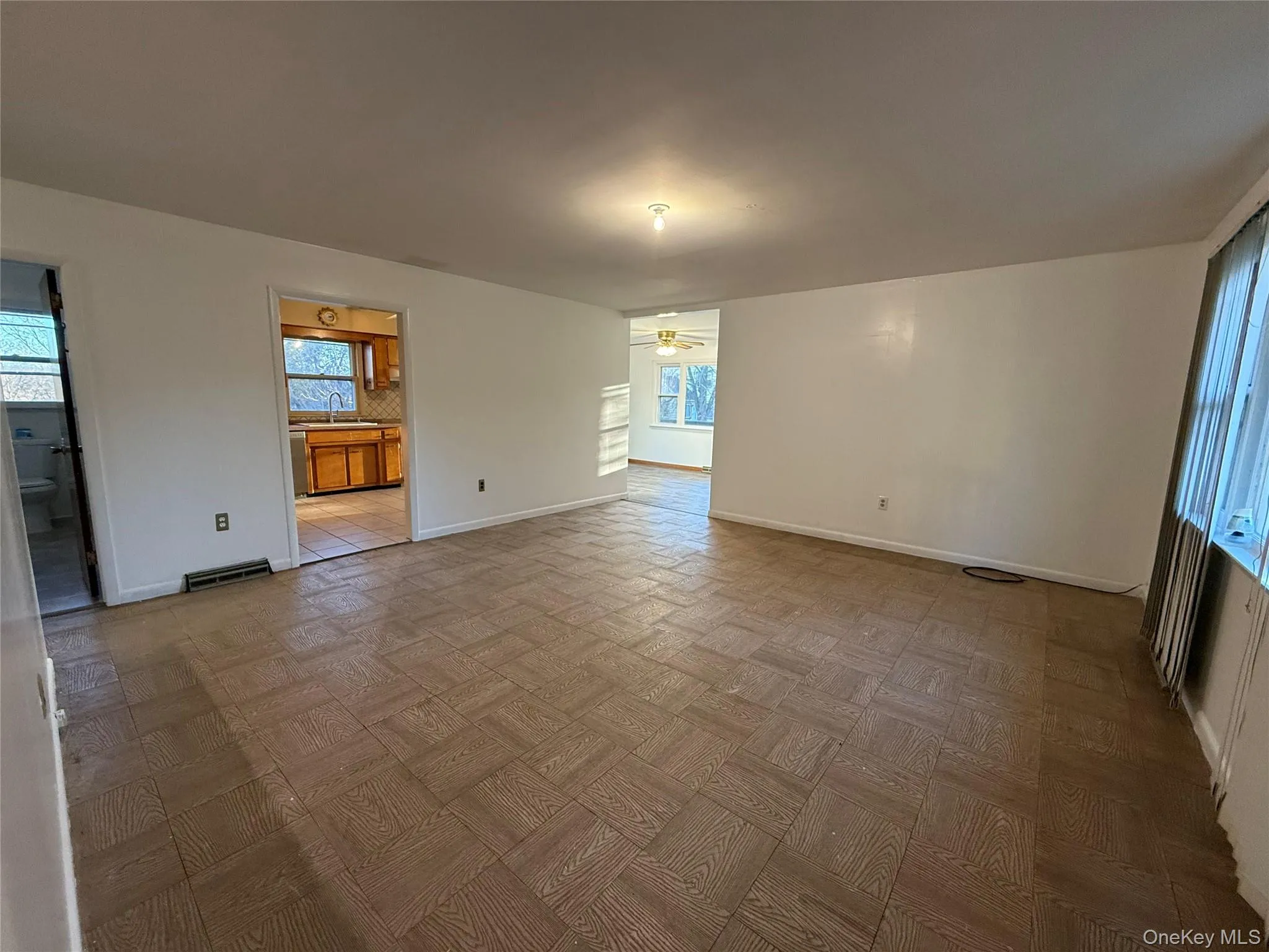 Unfurnished room with baseboards and ceiling fan Unfurnished room with baseboards and ceiling fan