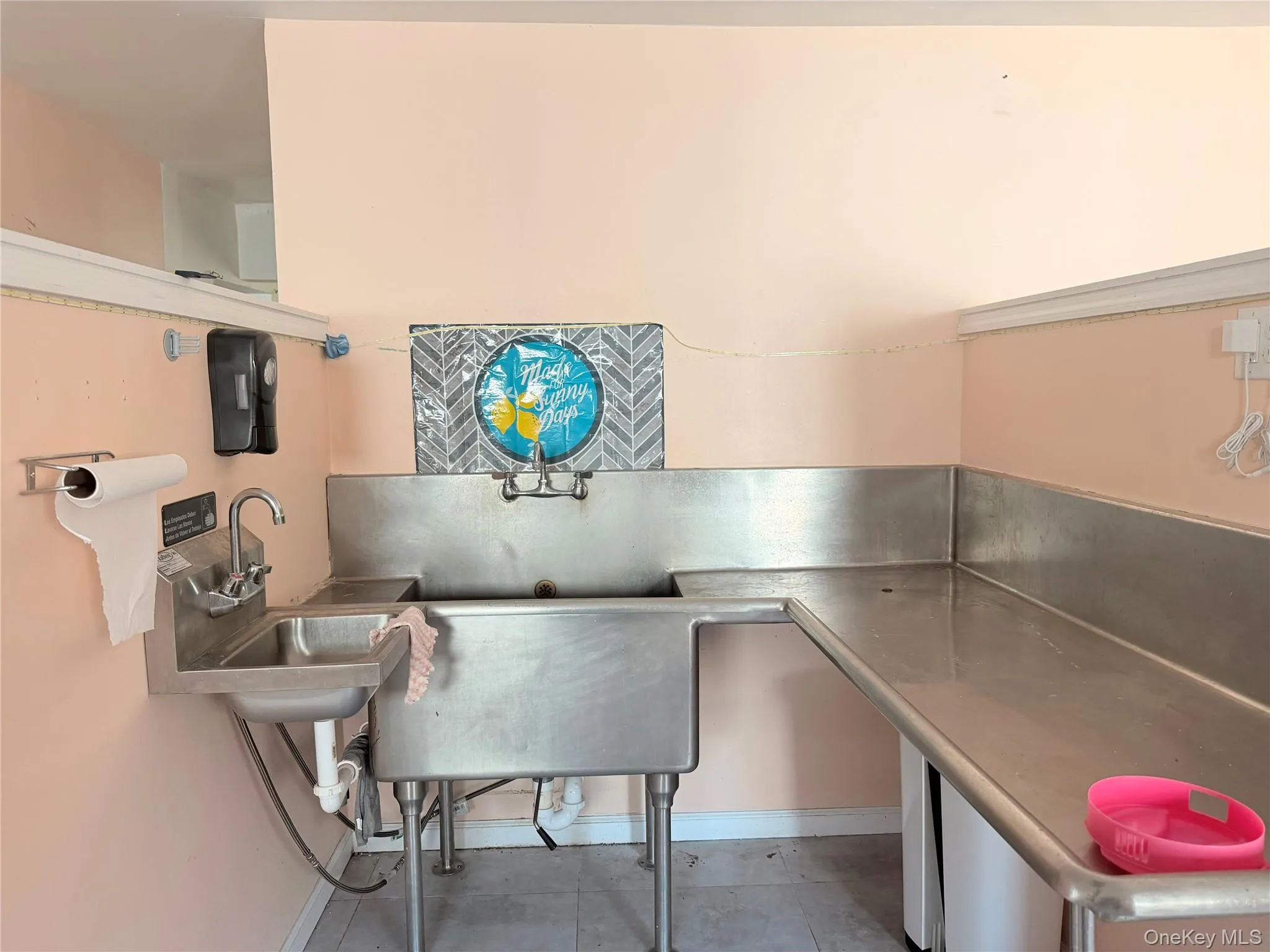 Office with a sink and light tile patterned floors Office with a sink and light tile patterned floors