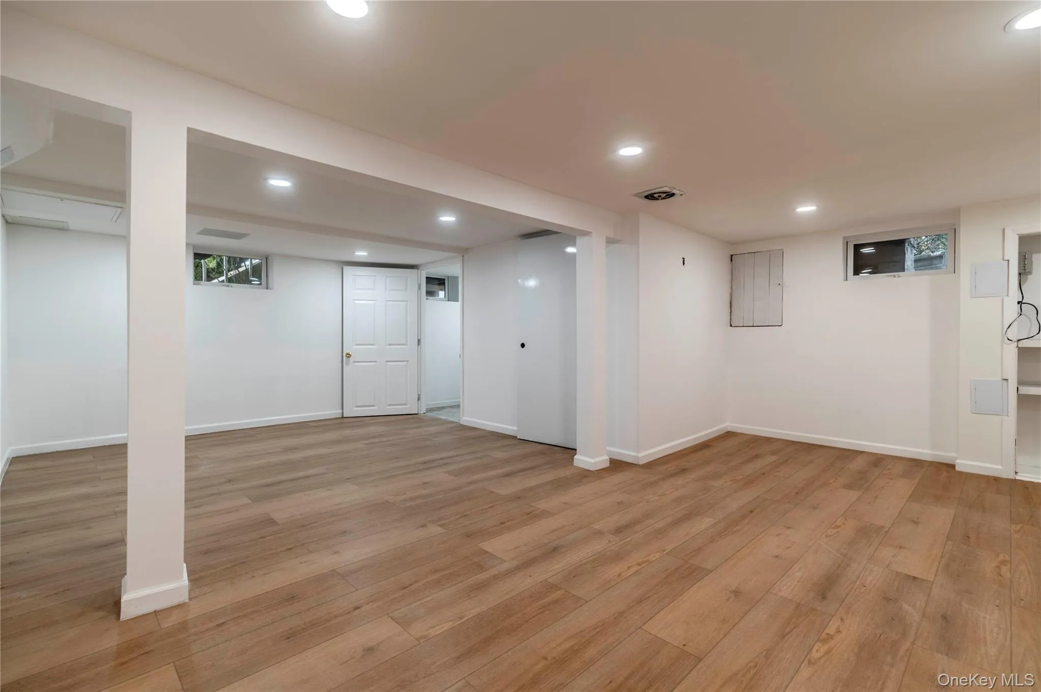 Finished basement featuring light wood finished floors and recessed lighting Finished basement featuring light wood finished floors and recessed lighting