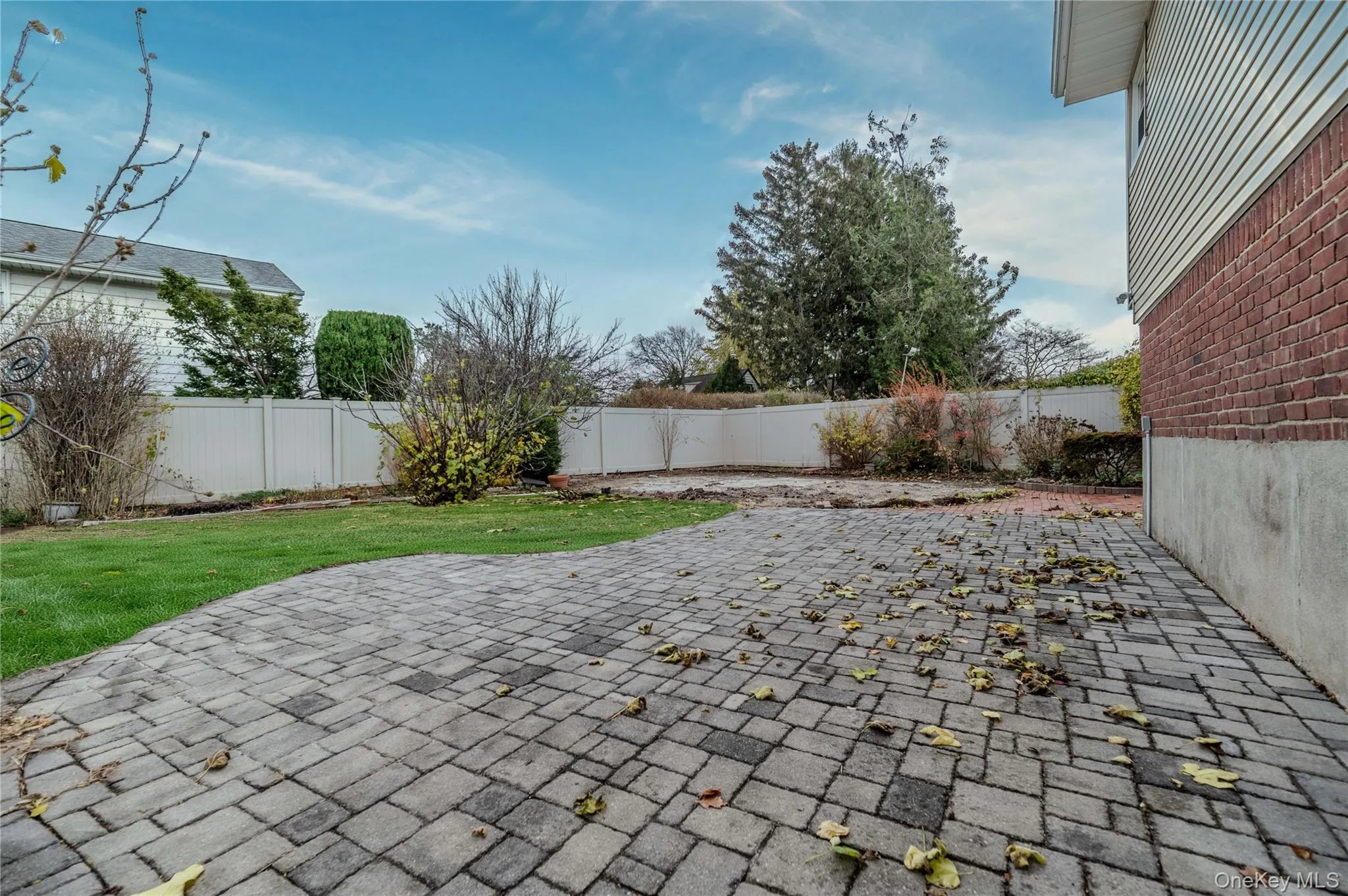 Fenced backyard with a patio Fenced backyard with a patio