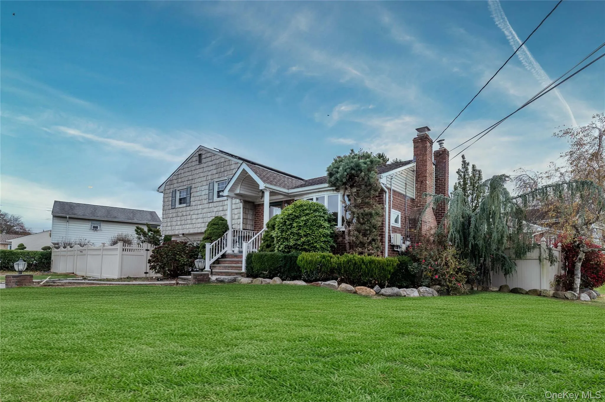 View of front of home with a chimney View of front of home with a chimney