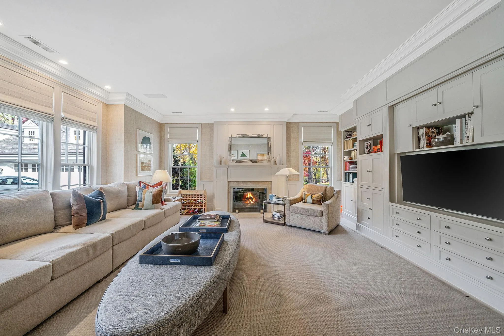 Family Room with a glass covered fireplace Family Room with a glass covered fireplace