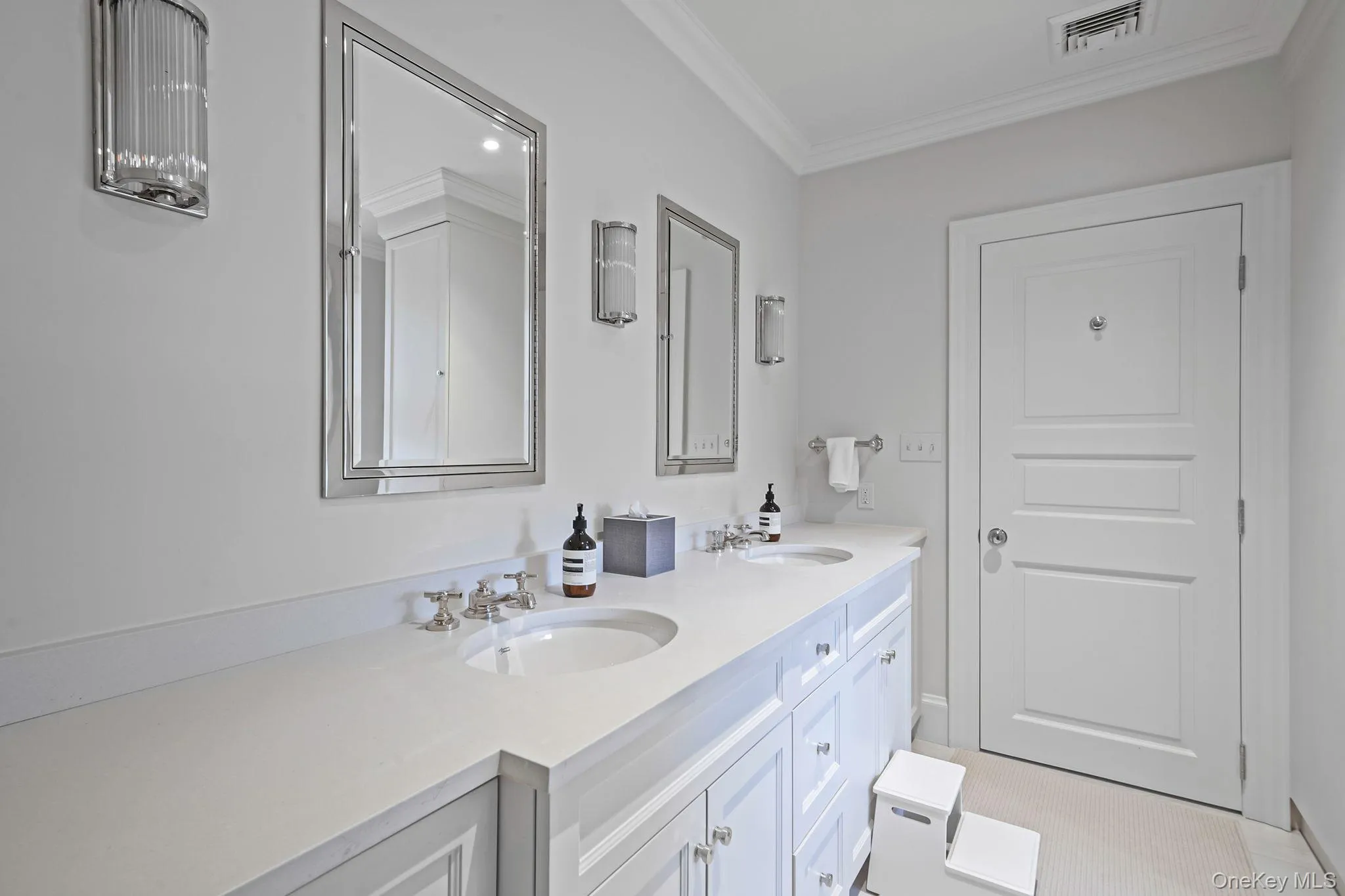 Full bathroom featuring double vanity and crown molding Full bathroom featuring double vanity and crown molding