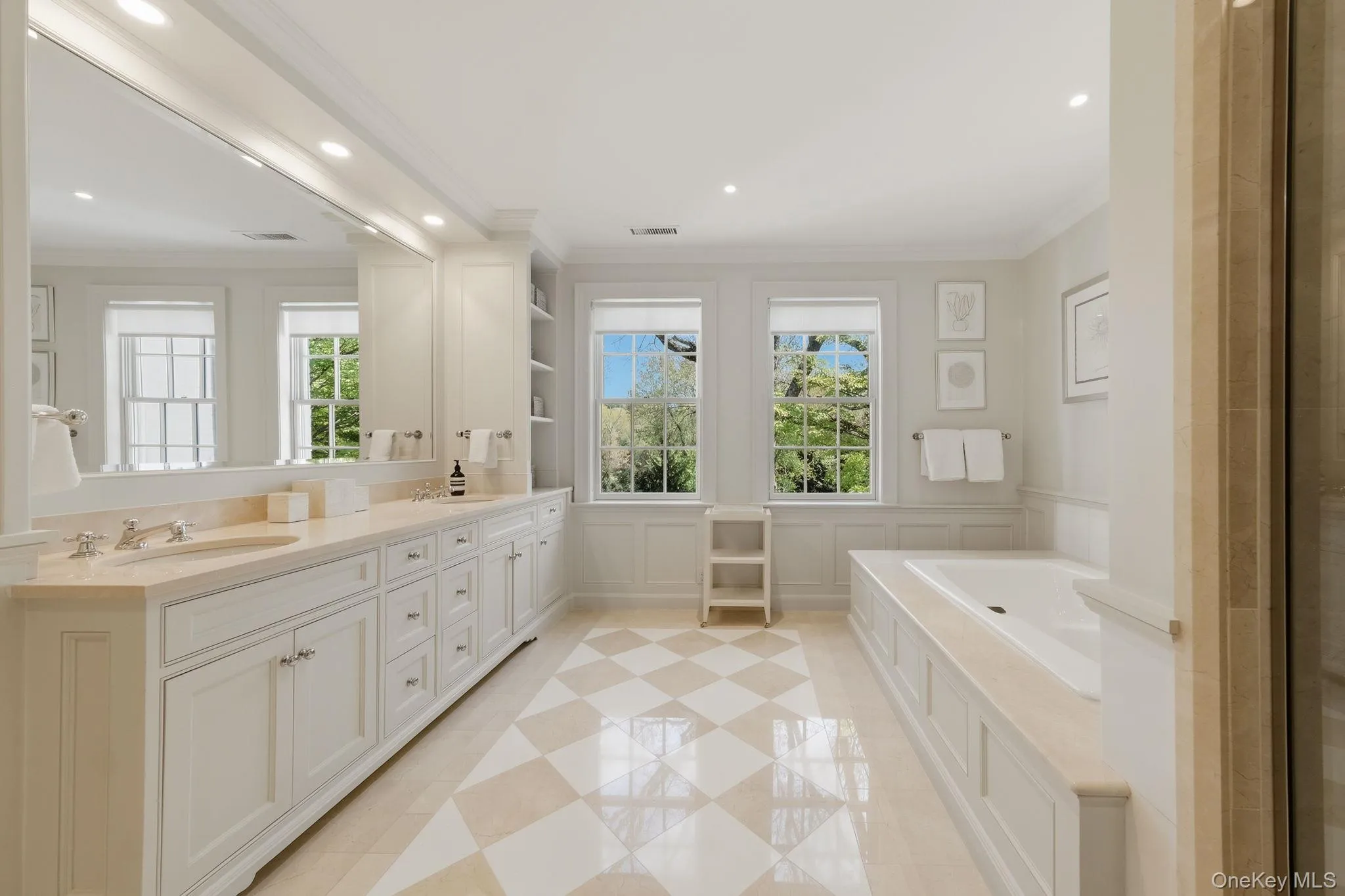 Primary bathroom featuring double vanity Primary bathroom featuring double vanity