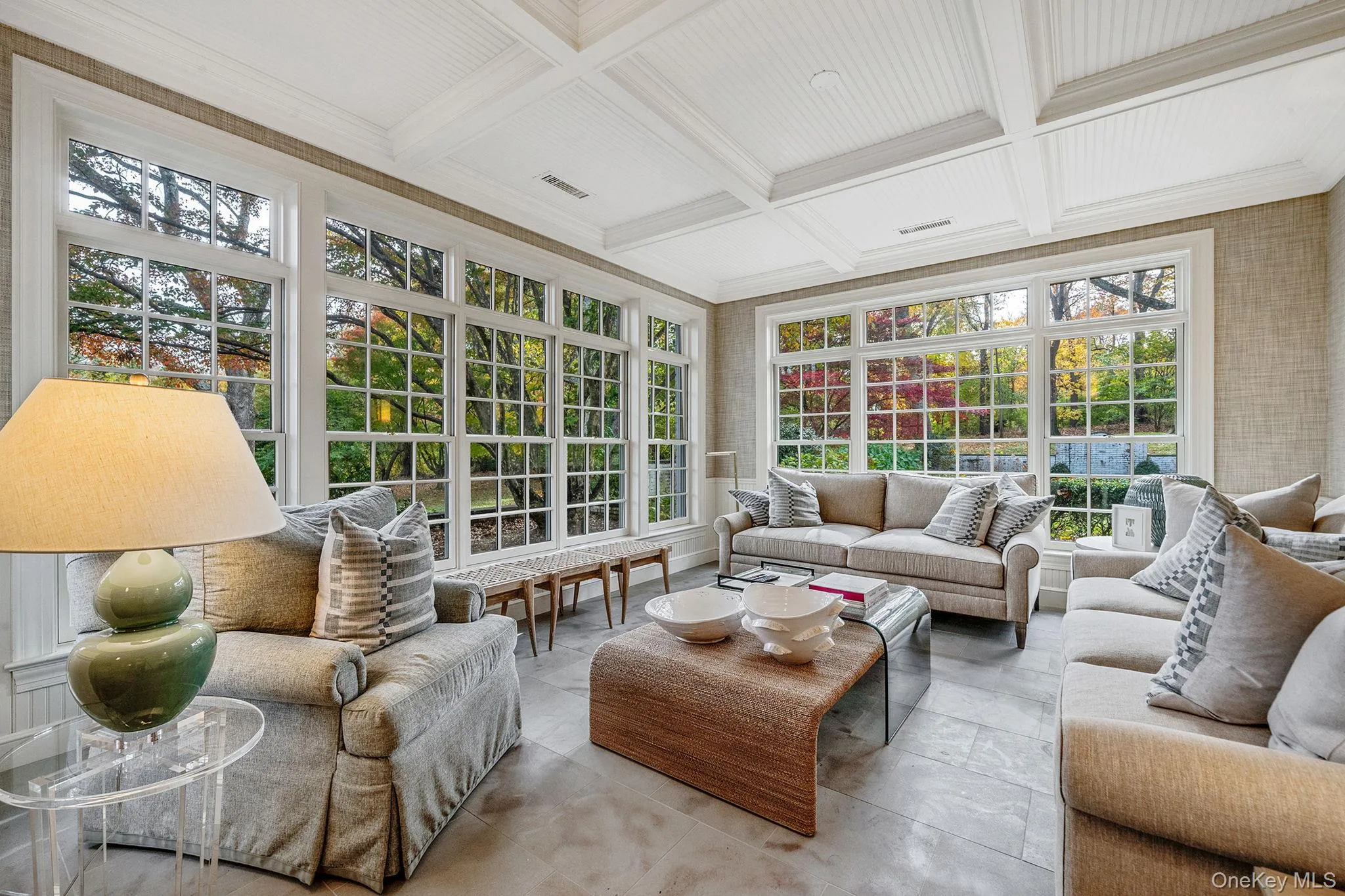 Sunroom / solarium featuring coffered ceiling, crown molding, and beam ceiling Sunroom / solarium featuring coffered ceiling, crown molding, and beam ceiling