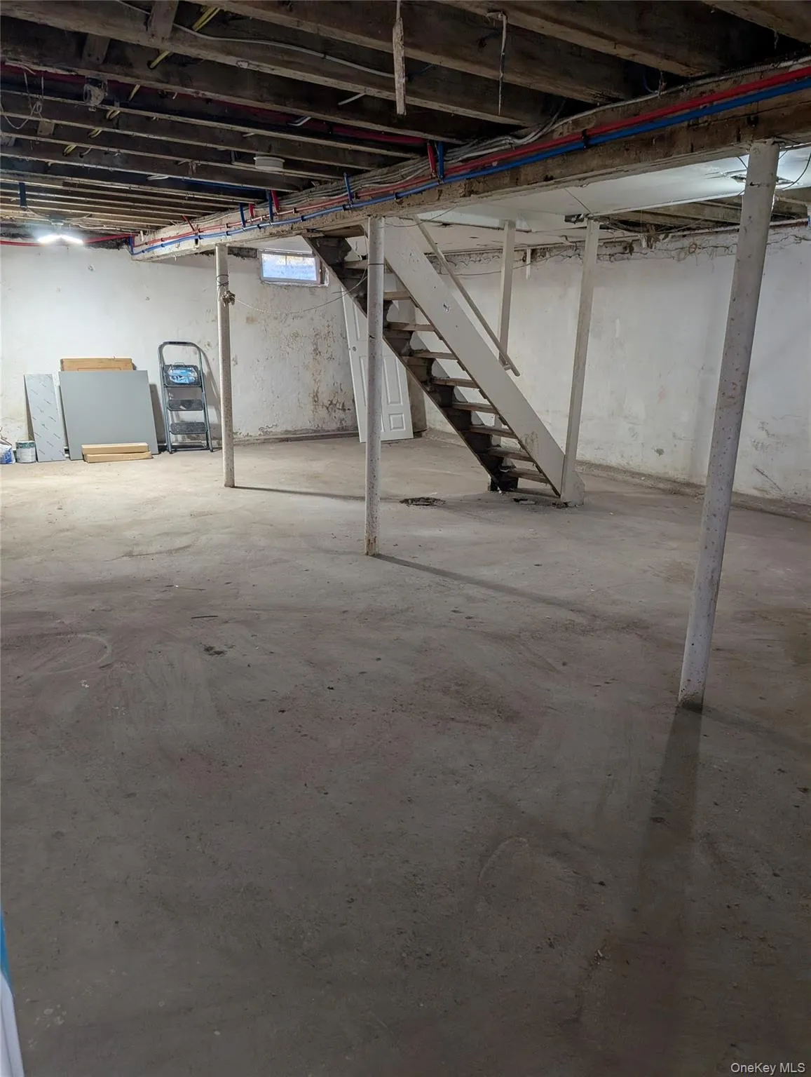 Below grade area featuring stairway Below grade area featuring stairway